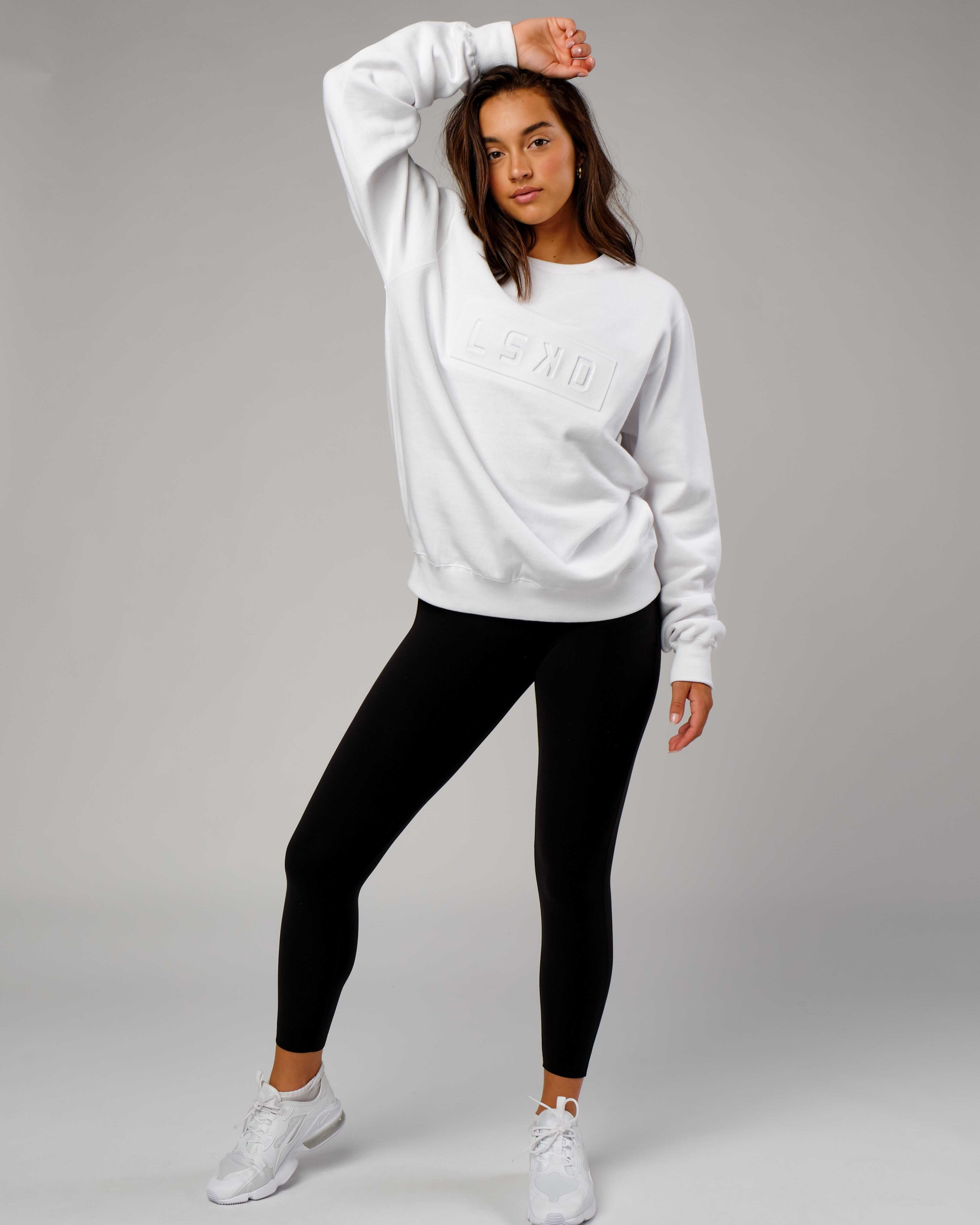 Model wearing Unisex Imprint Sweater - White