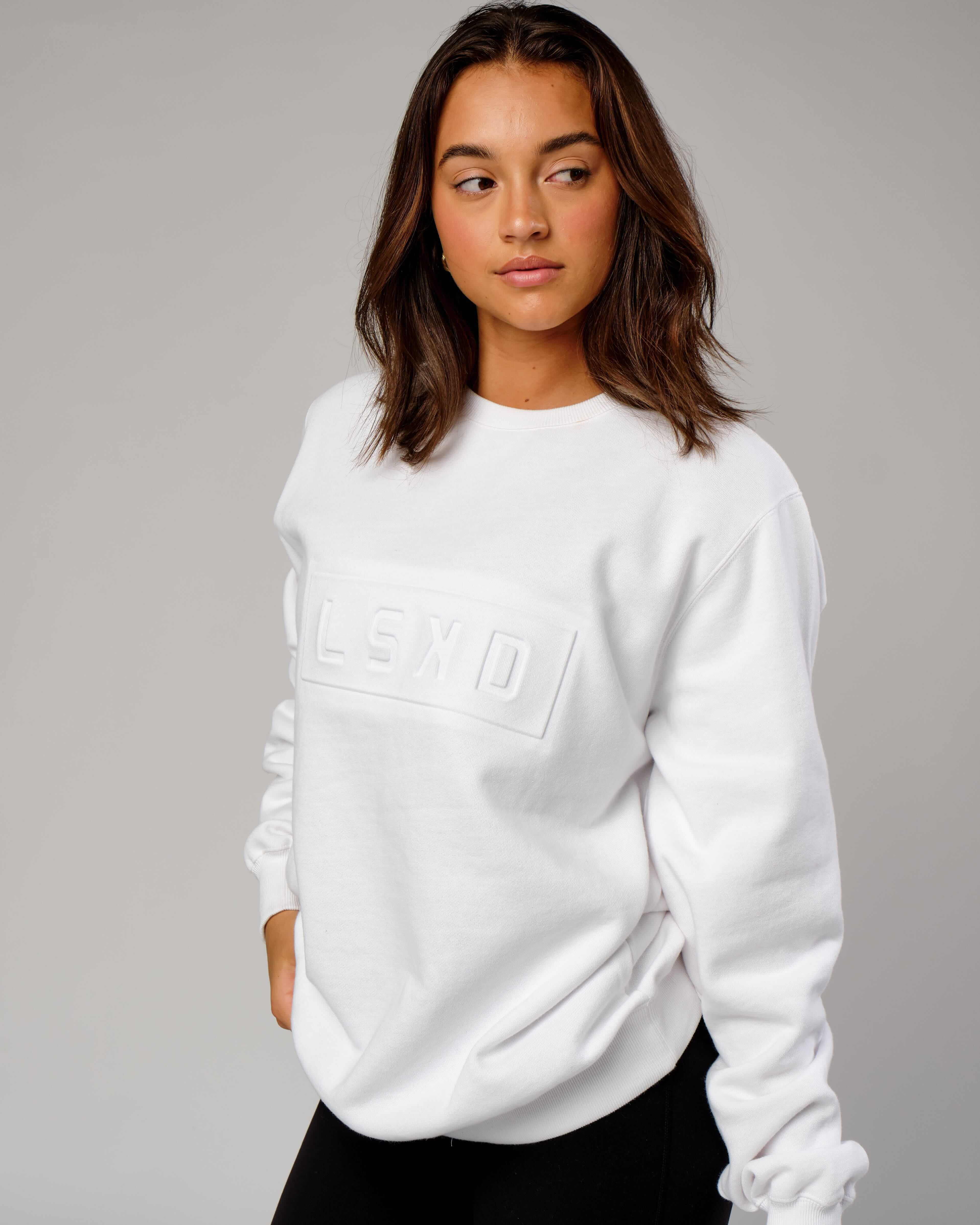 Model wearing Unisex Imprint Sweater - White