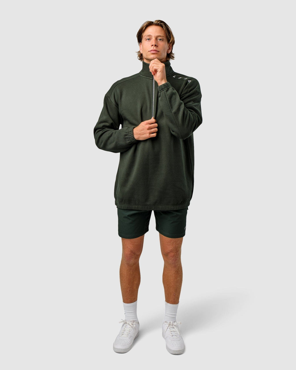Model wearing Competitor 1/4 Zip Sweater - Forest
