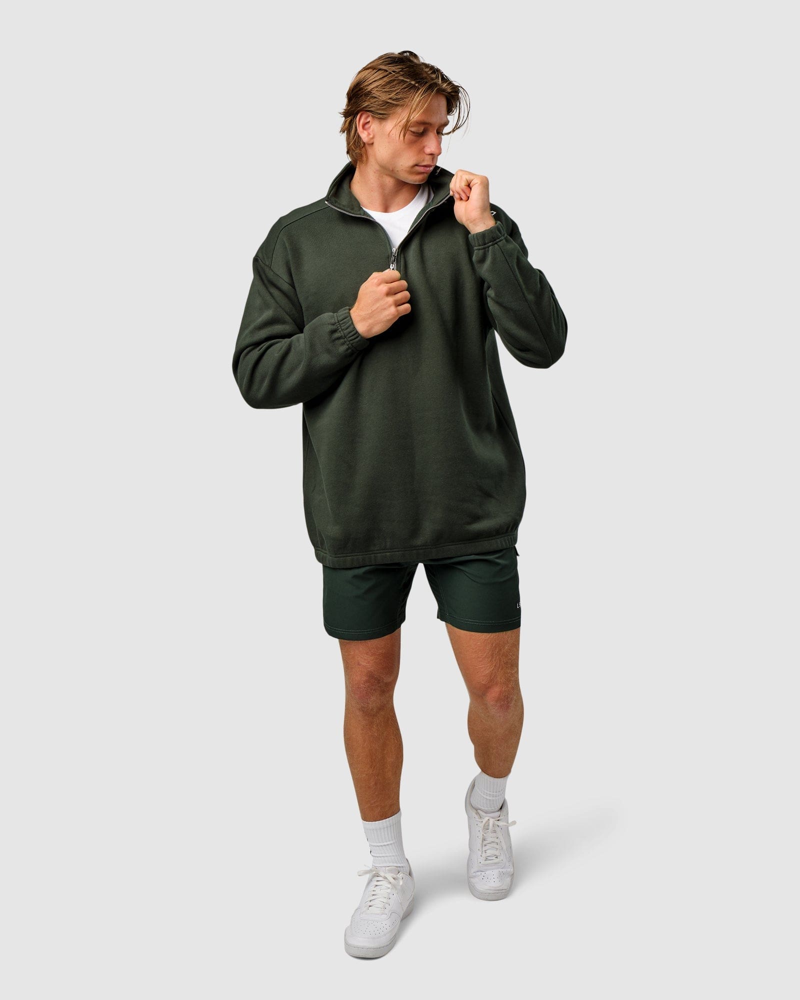 Model wearing Competitor 1/4 Zip Sweater - Forest