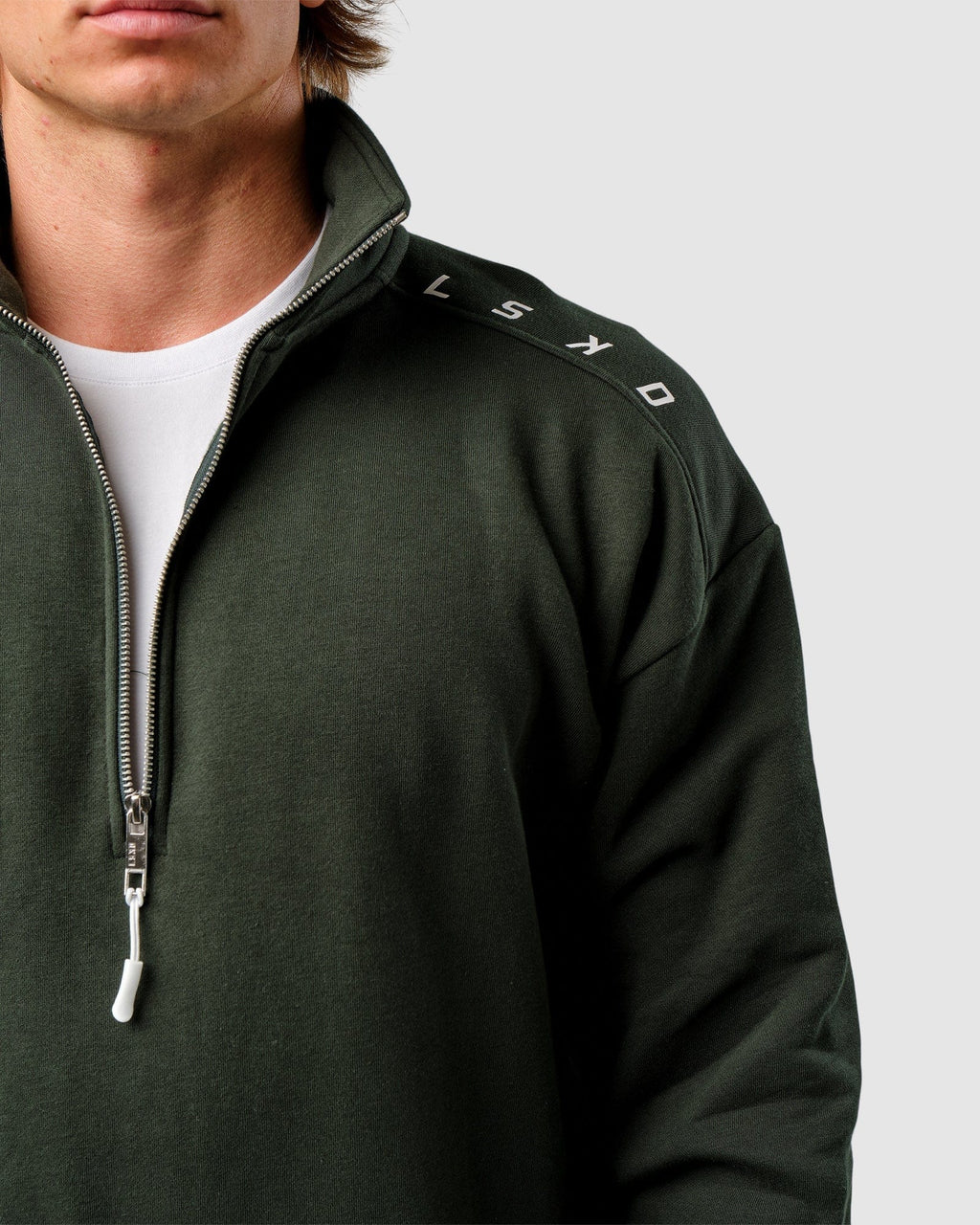 Model wearing Competitor 1/4 Zip Sweater - Forest