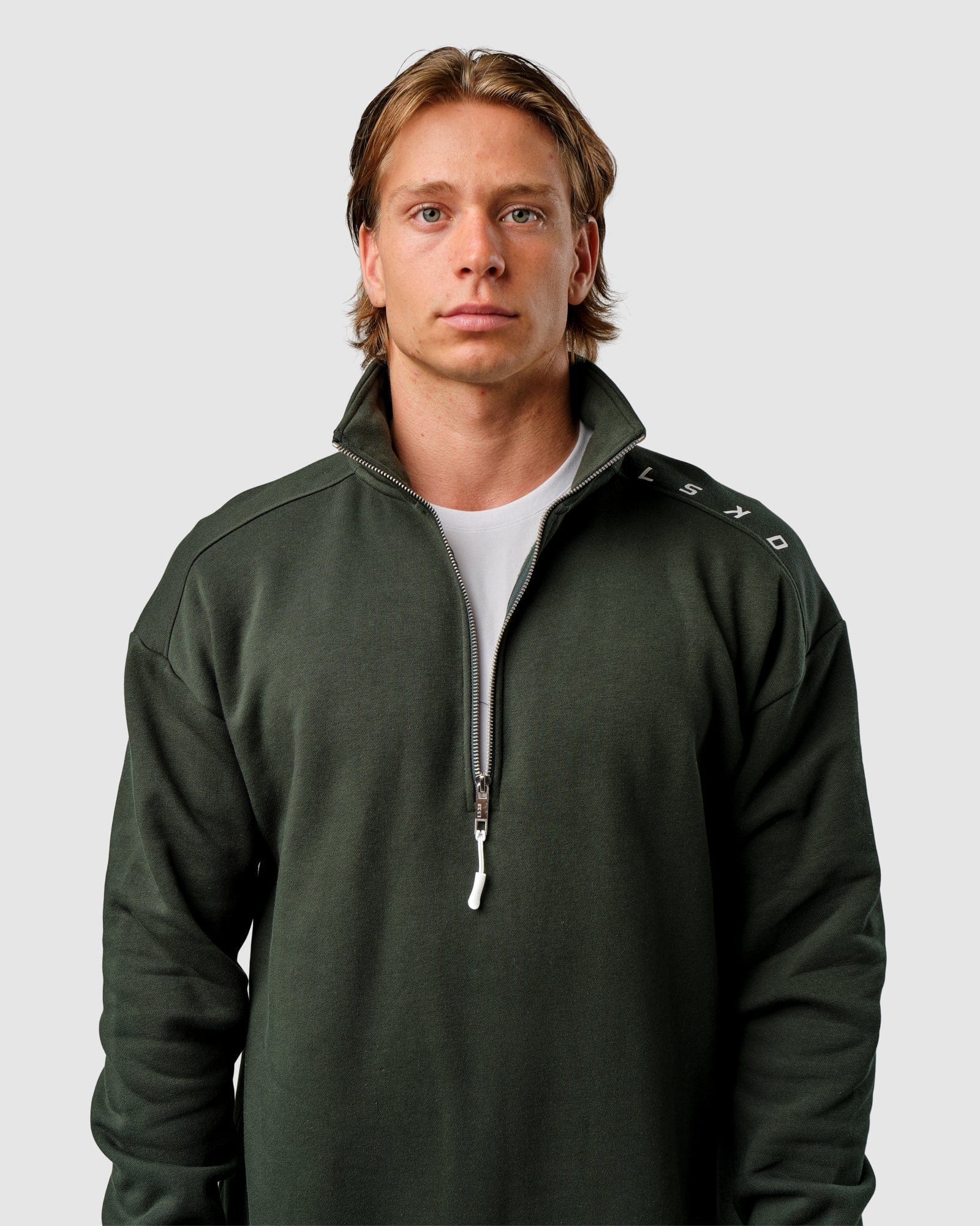 Model wearing Competitor 1/4 Zip Sweater - Forest