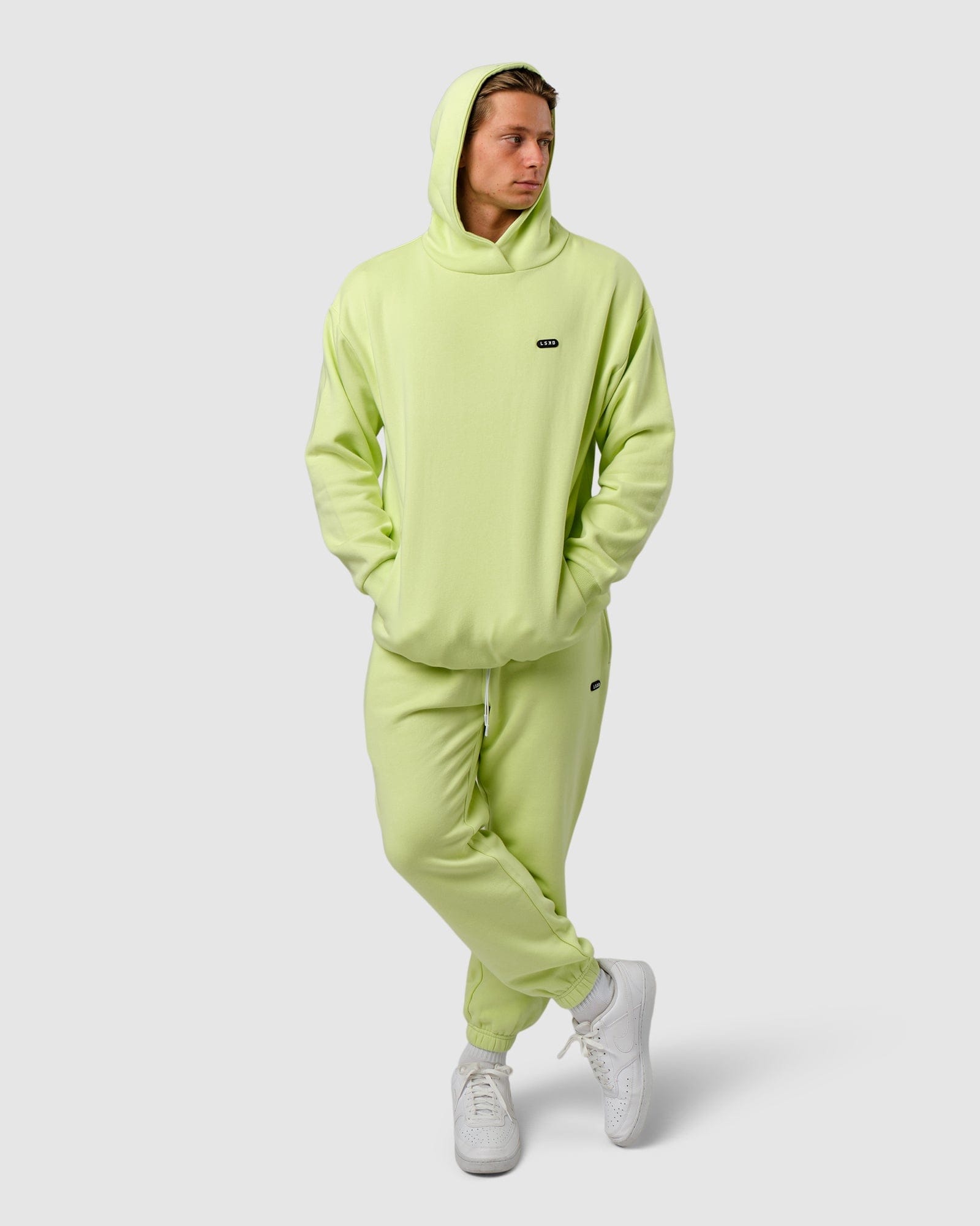 Model wearing Capsule Hoodie Oversize - Pastel Lime