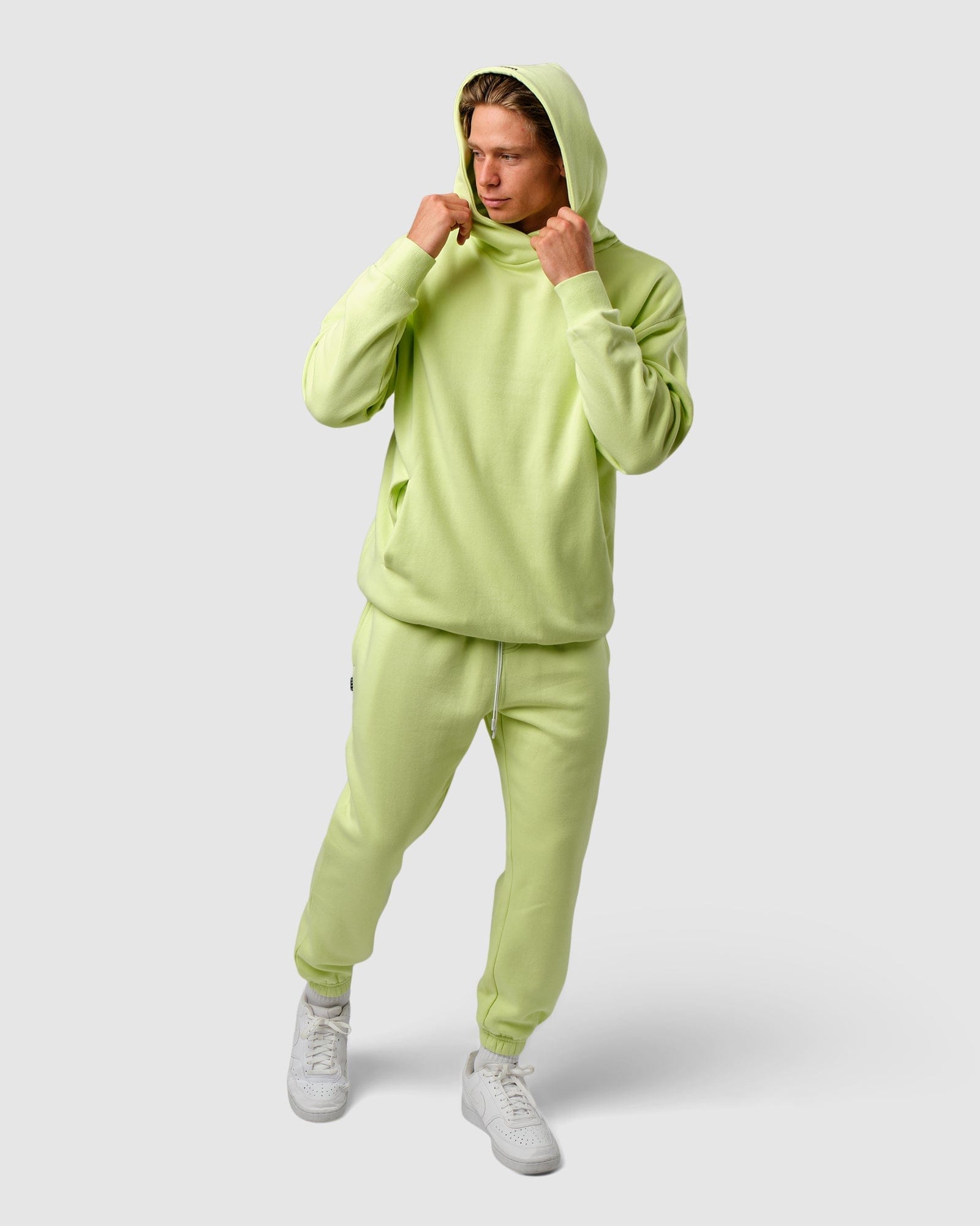 Model wearing Capsule Hoodie Oversize - Pastel Lime