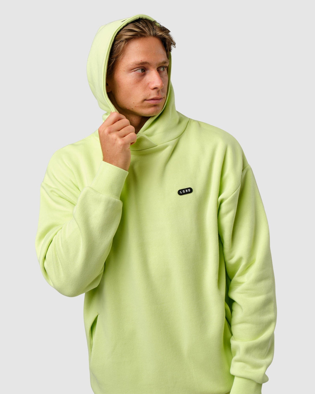 Model wearing Capsule Hoodie Oversize - Pastel Lime