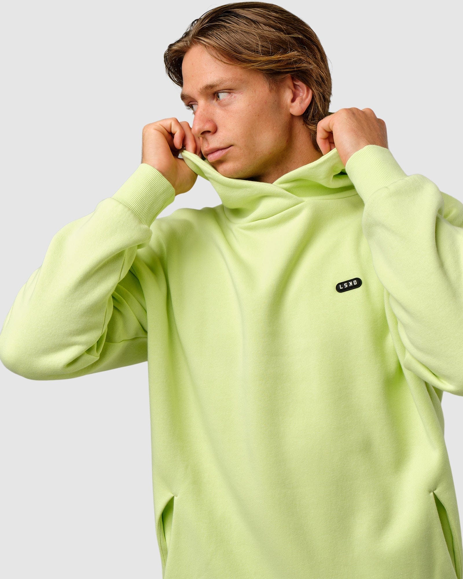 Model wearing Capsule Hoodie Oversize - Pastel Lime