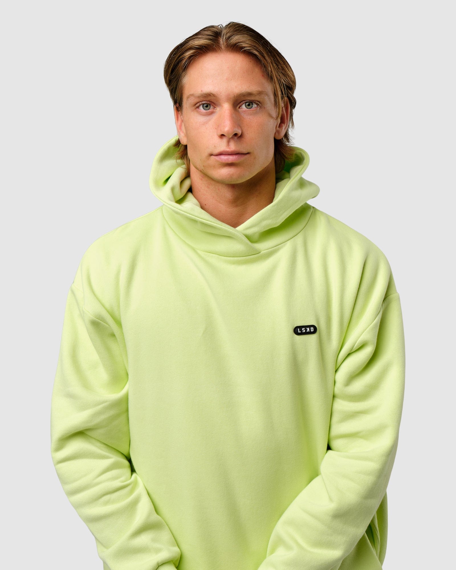 Model wearing Capsule Hoodie Oversize - Pastel Lime