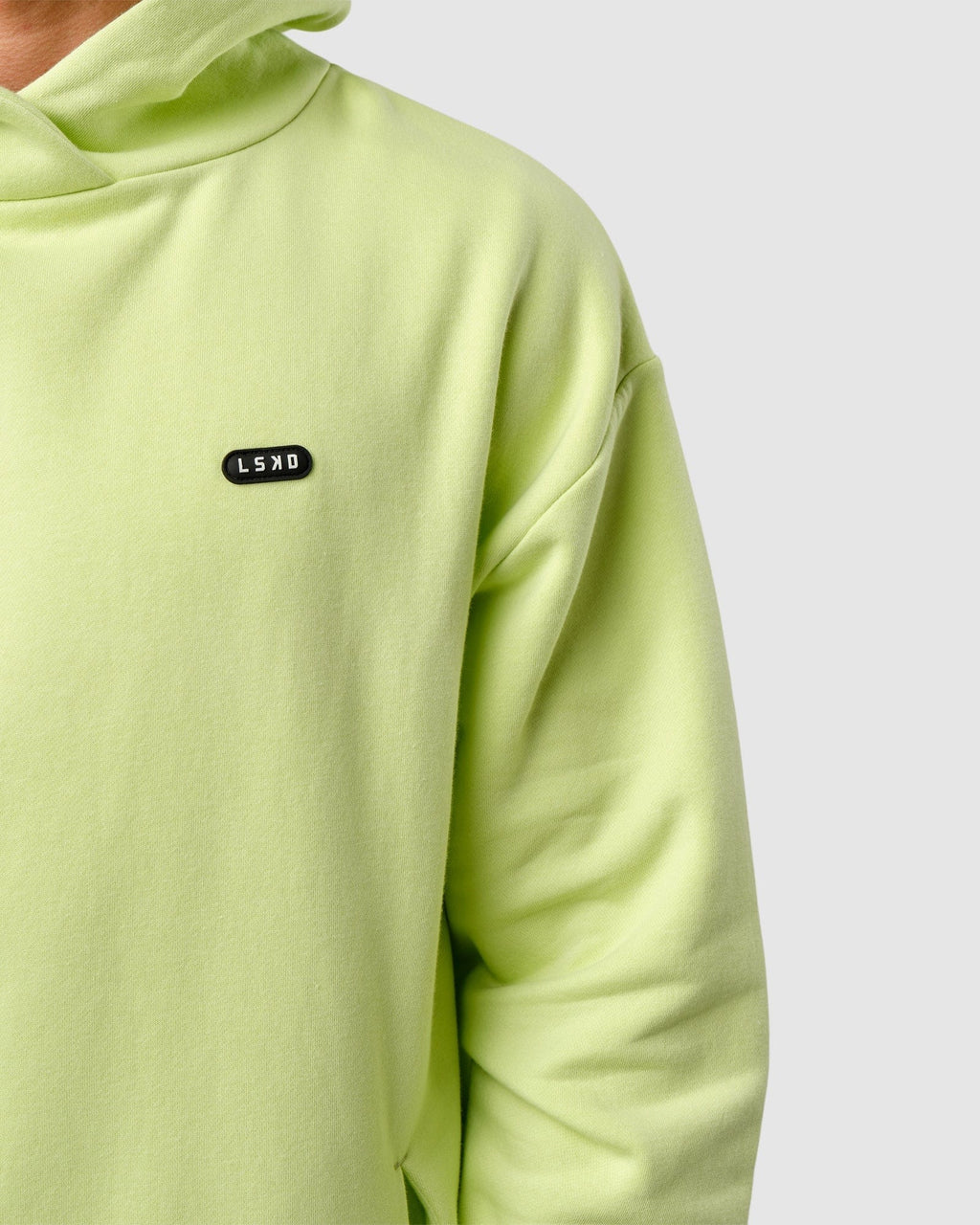 Model wearing Capsule Hoodie Oversize - Pastel Lime