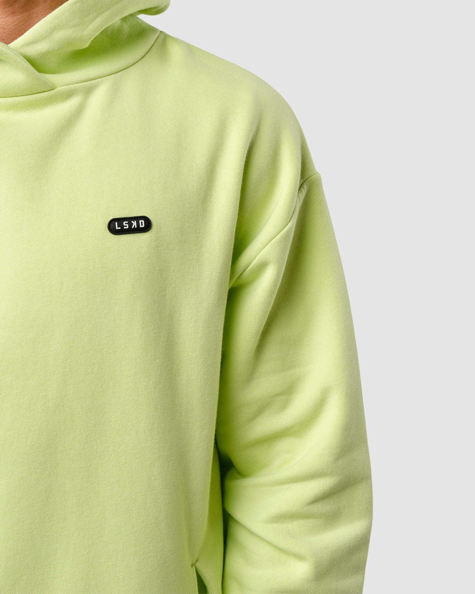Model wearing Capsule Hoodie Oversize - Pastel Lime
