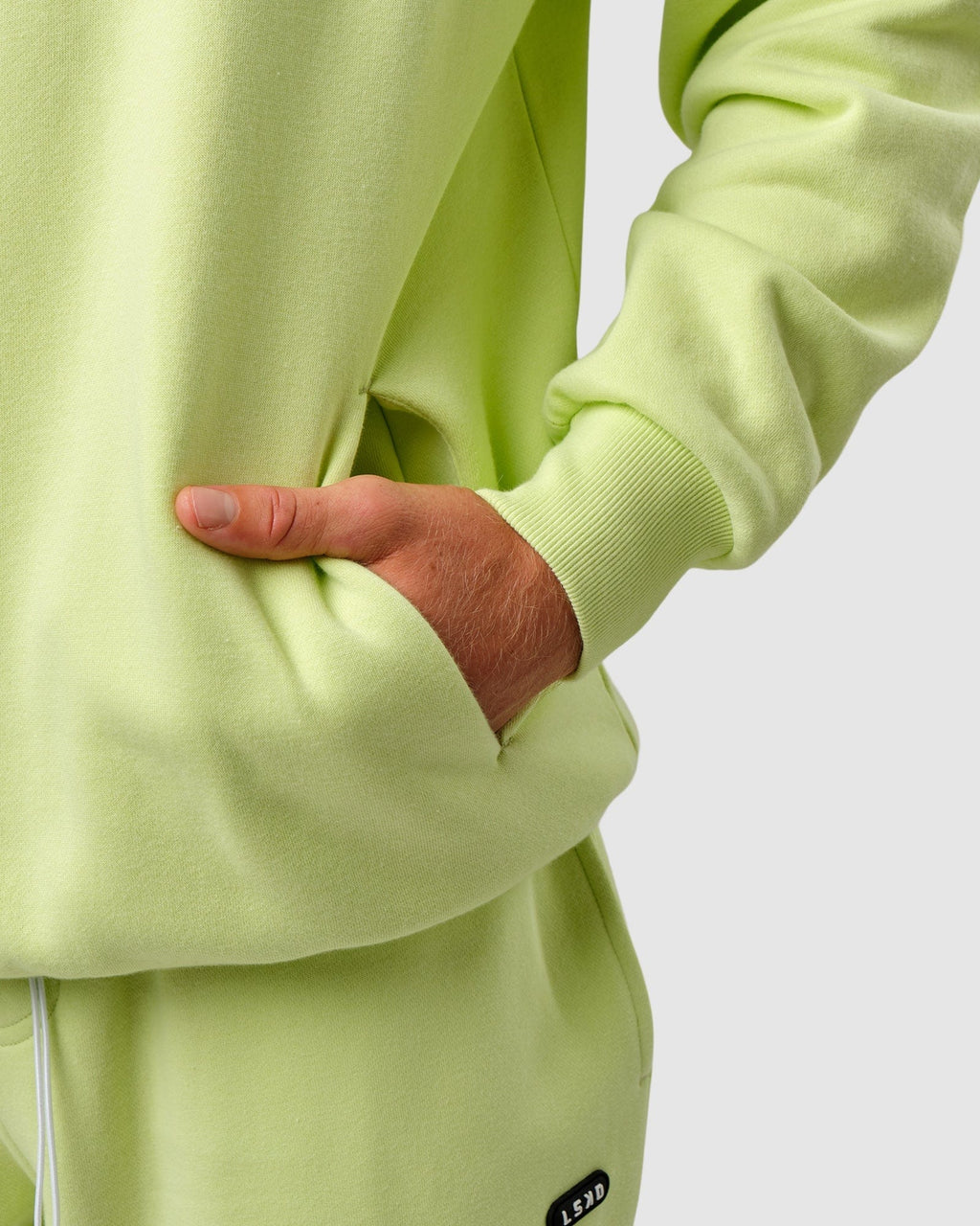Model wearing Capsule Hoodie Oversize - Pastel Lime