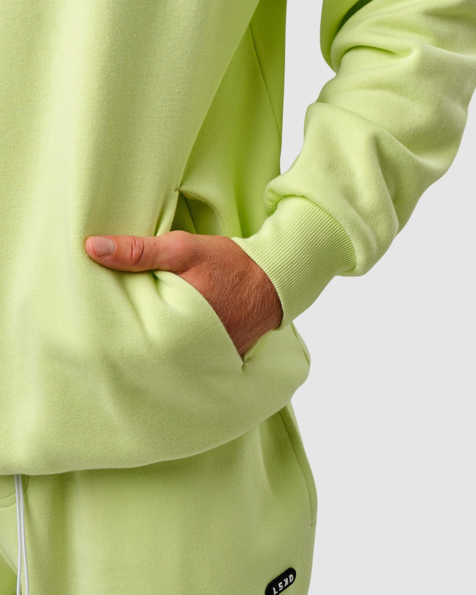 Model wearing Capsule Hoodie Oversize - Pastel Lime