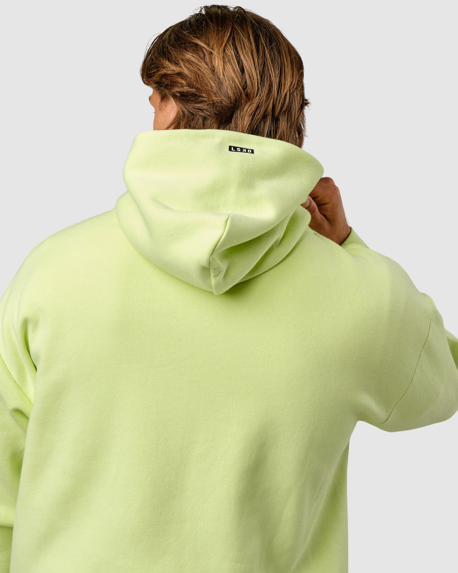 Model wearing Capsule Hoodie Oversize - Pastel Lime