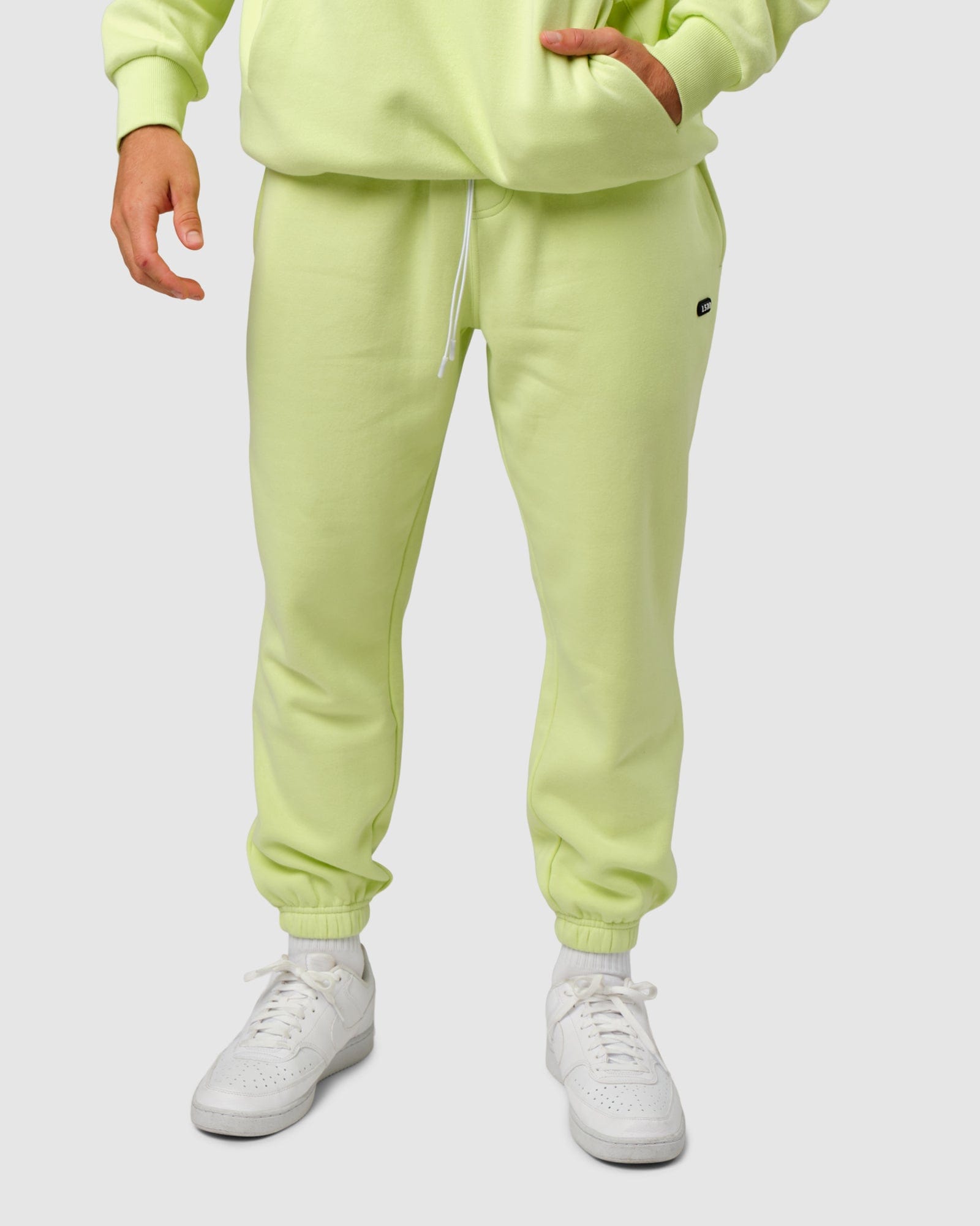 Model wearing Capsule Track Pant - Pastel Lime