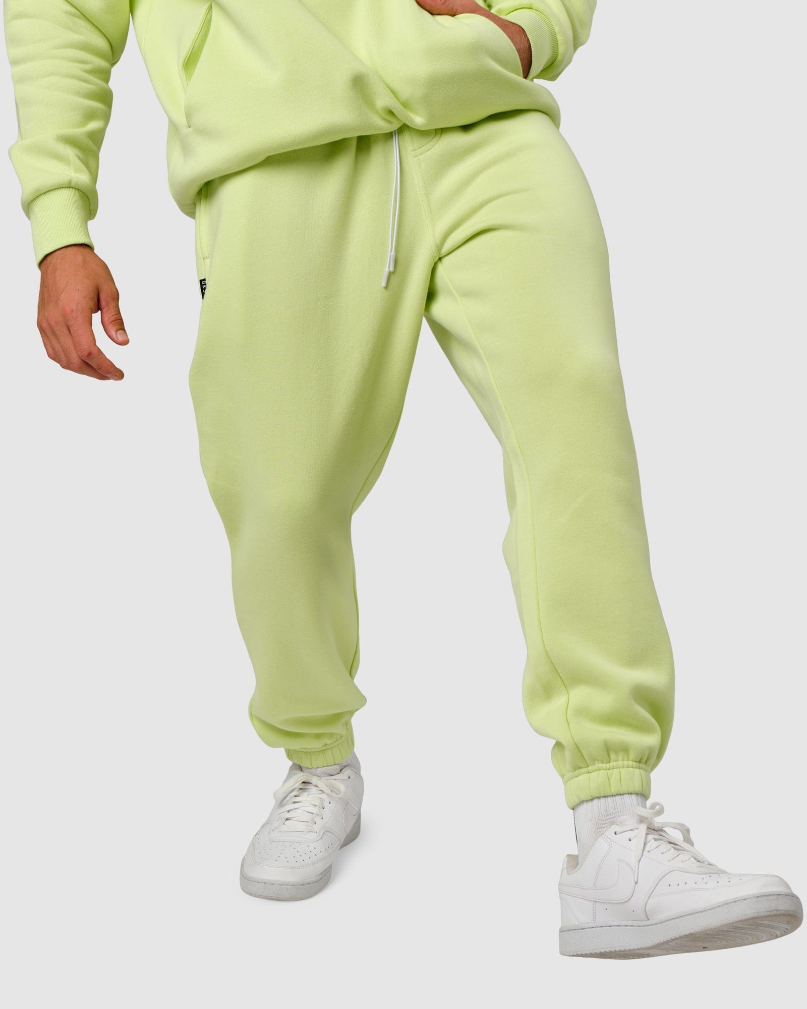 Model wearing Capsule Track Pant - Pastel Lime
