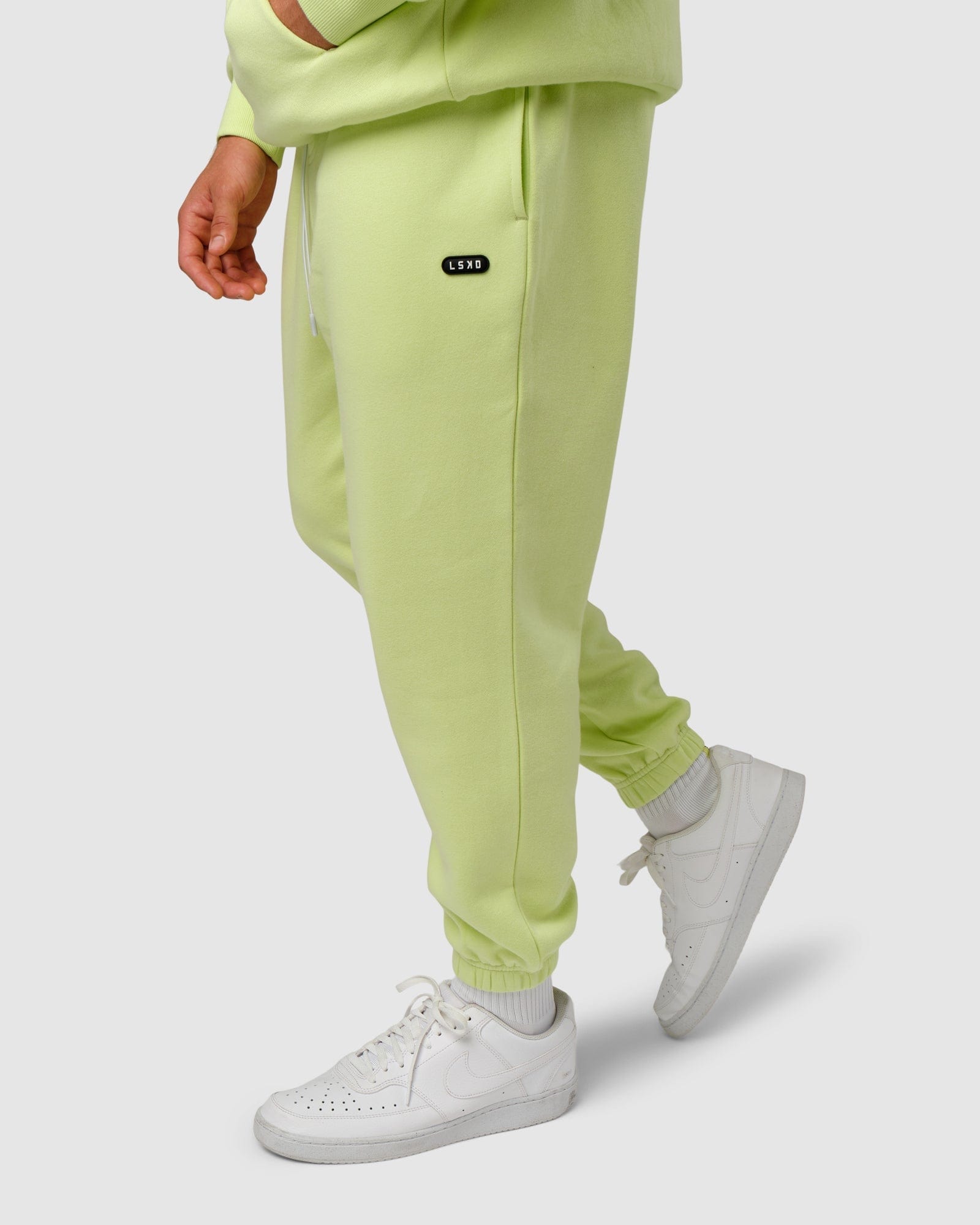 Model wearing Capsule Track Pant - Pastel Lime