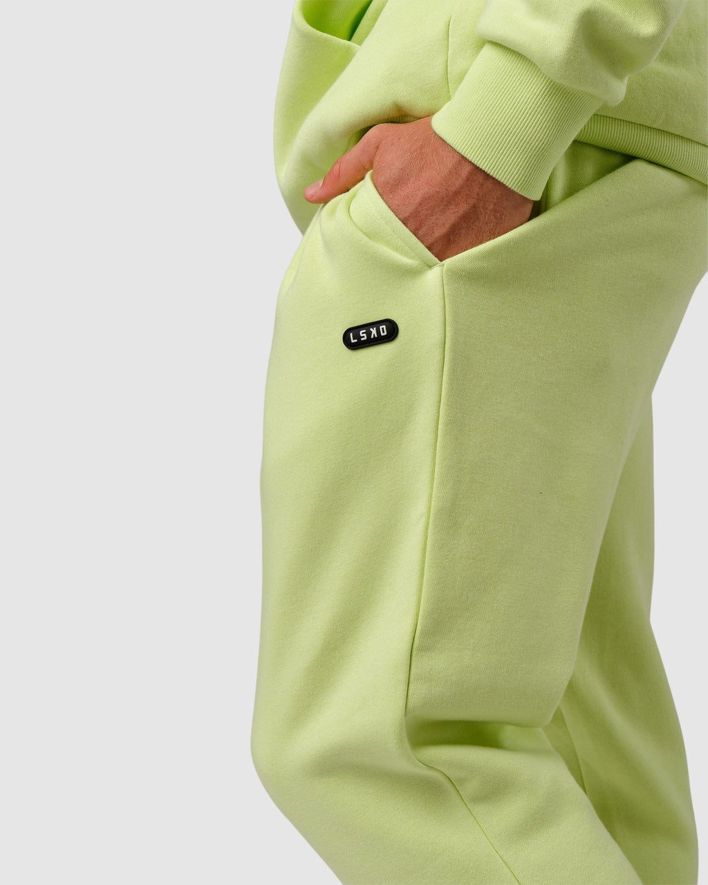 Model wearing Capsule Track Pant - Pastel Lime