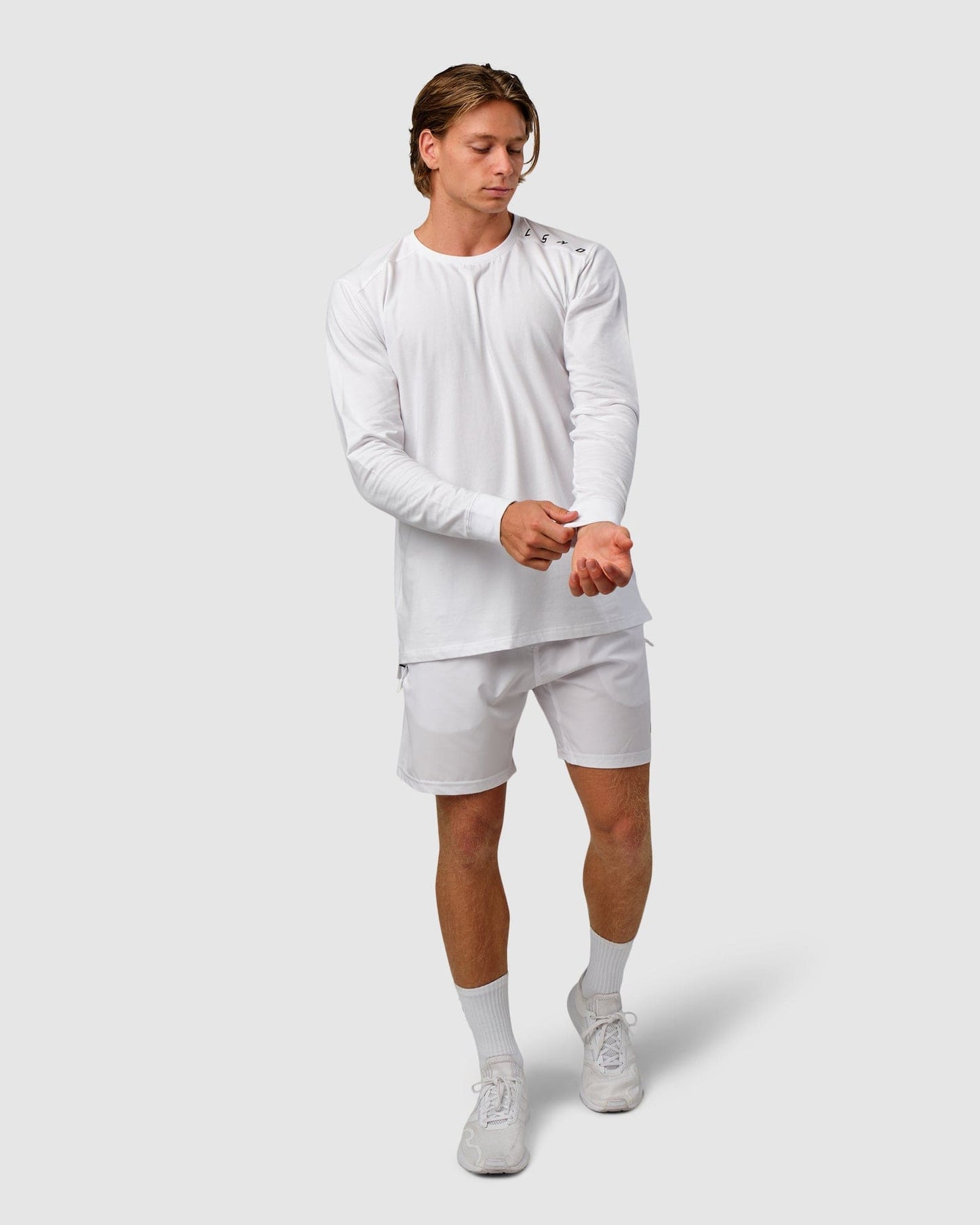 Model wearing Competitor LS Tee - White