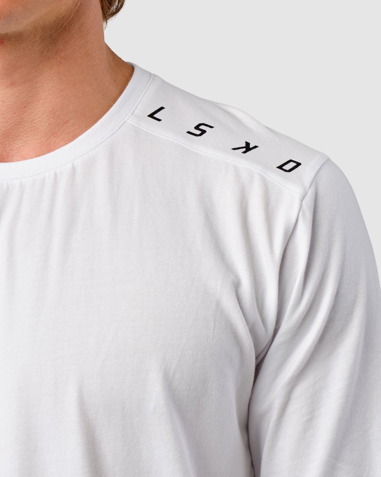 Model wearing Competitor LS Tee - White