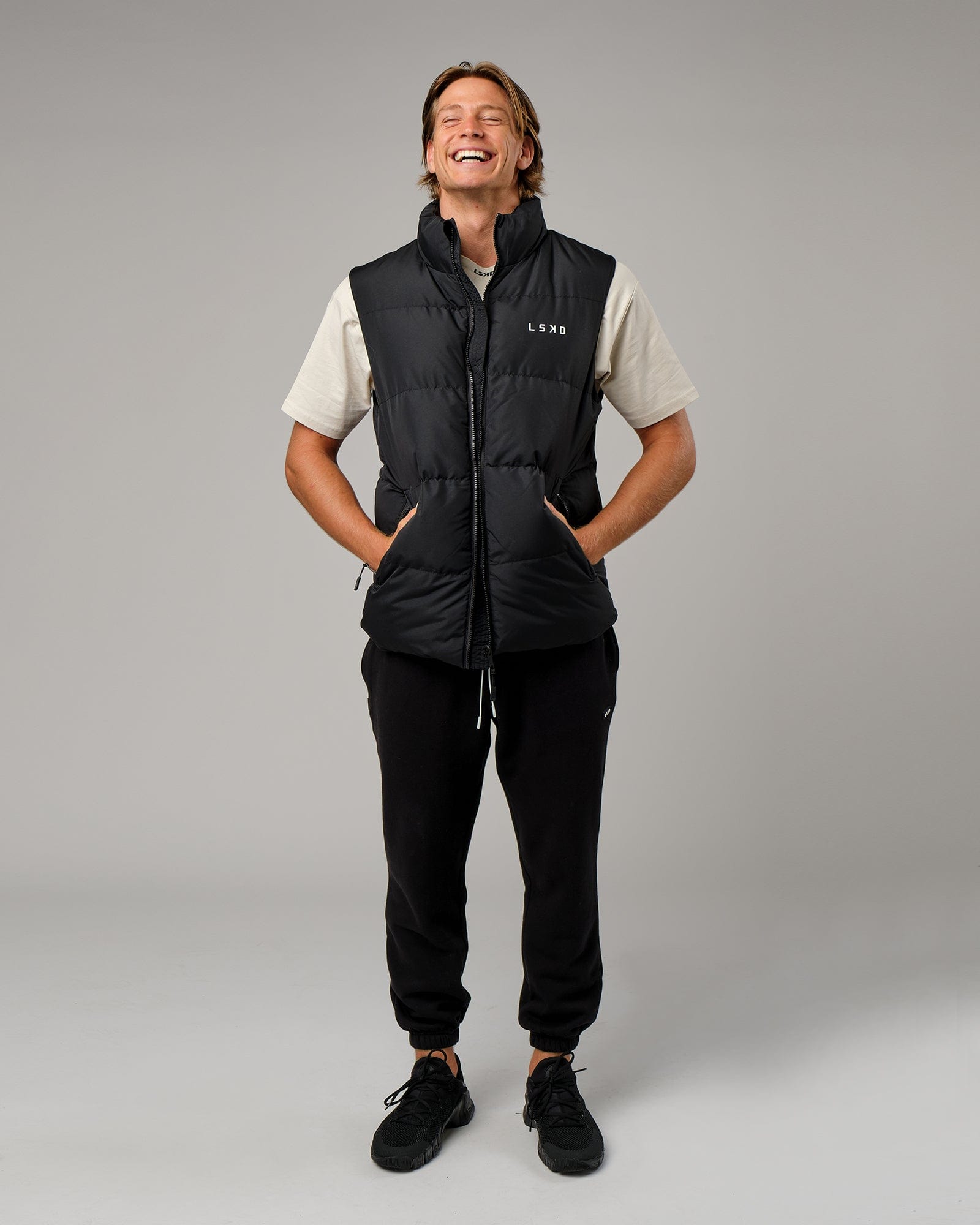 Model wearing Essential Puffer Vest - Black