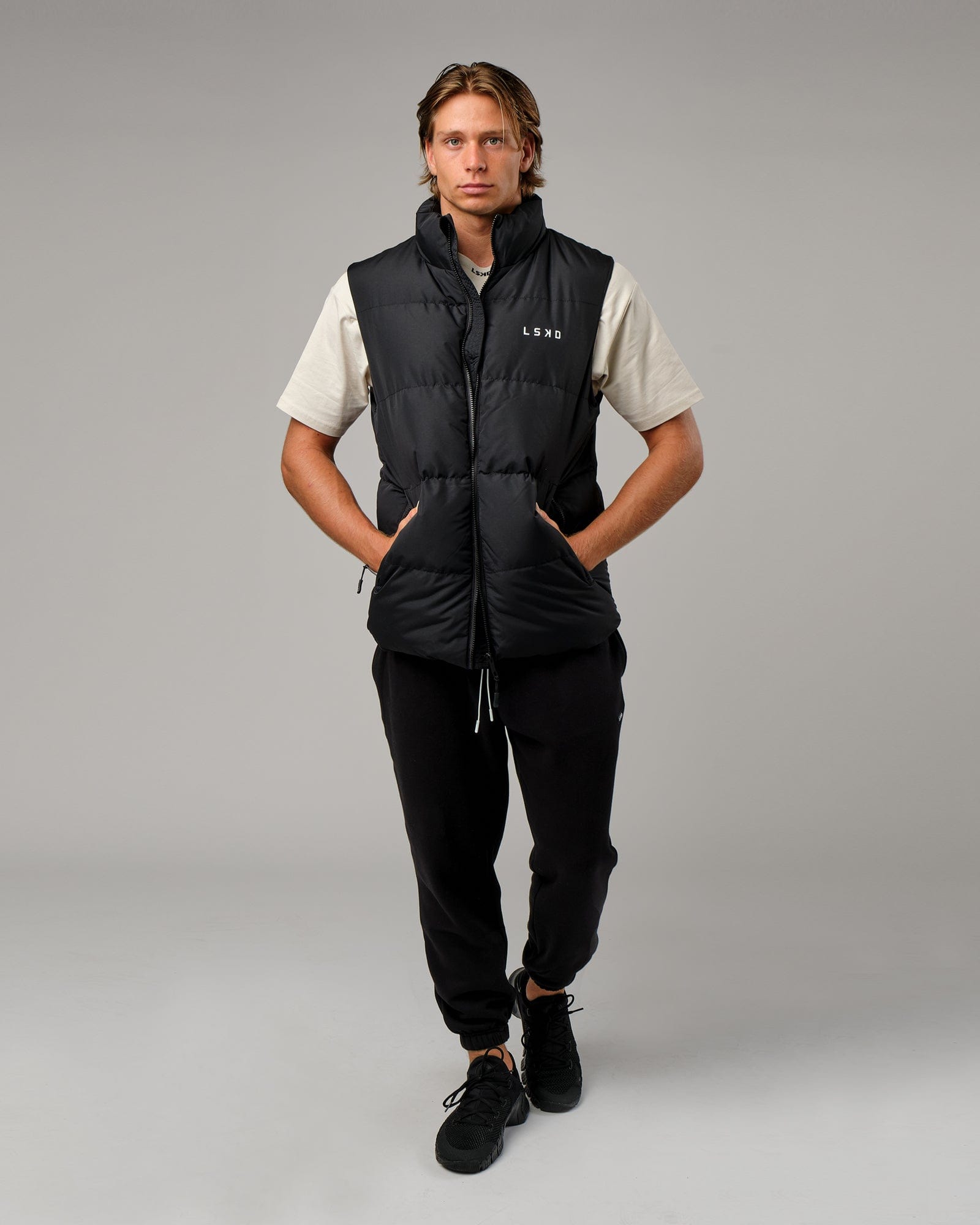 Model wearing Essential Puffer Vest - Black