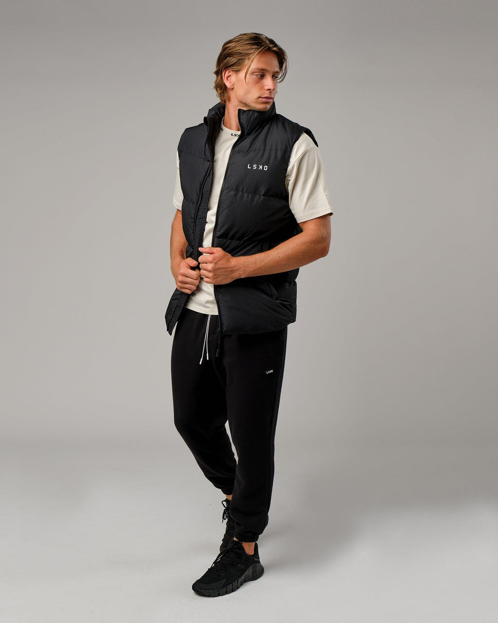 Model wearing Essential Puffer Vest - Black
