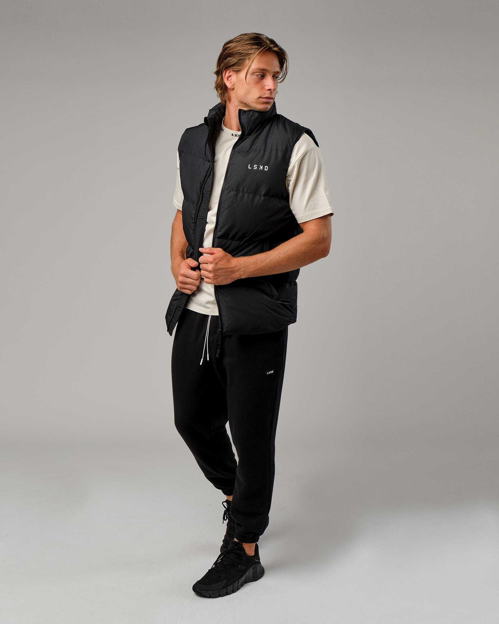 Model wearing Essential Puffer Vest - Black