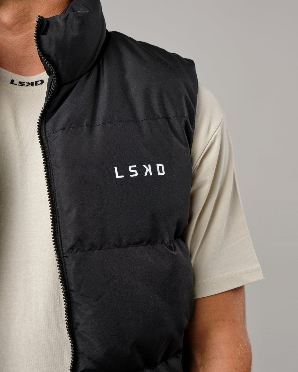 Model wearing Essential Puffer Vest - Black