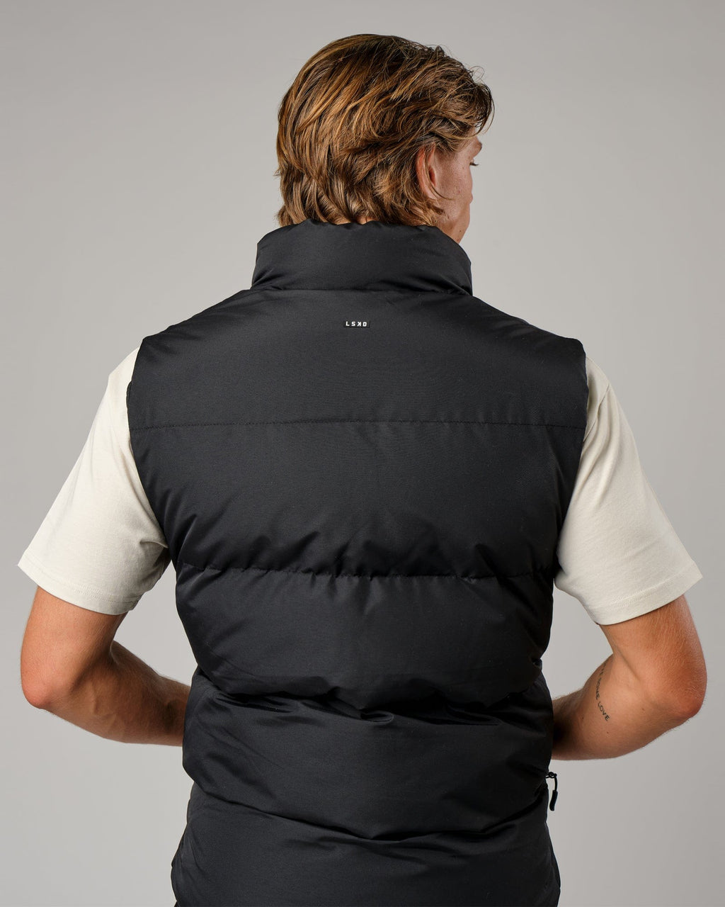 Model wearing Essential Puffer Vest - Black