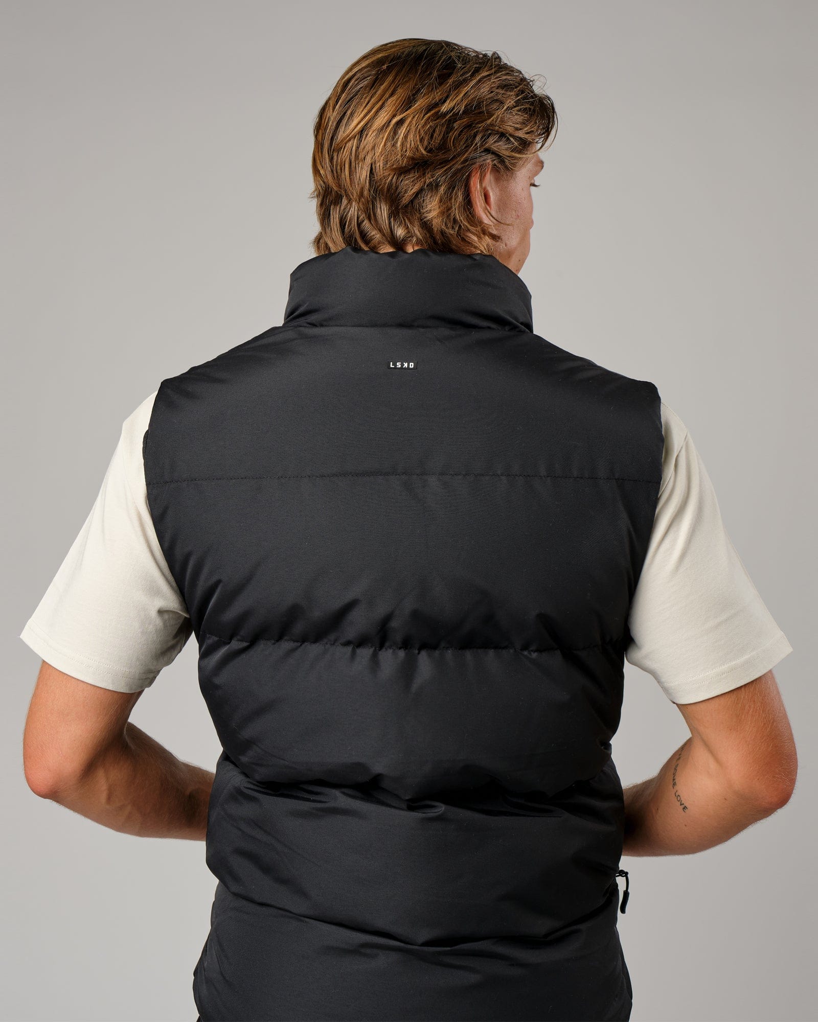Model wearing Essential Puffer Vest - Black