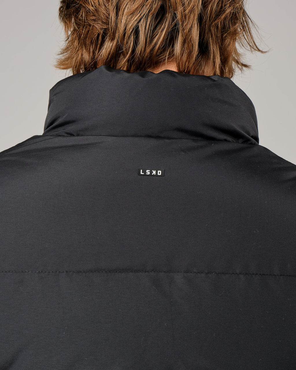Model wearing Essential Puffer Vest - Black