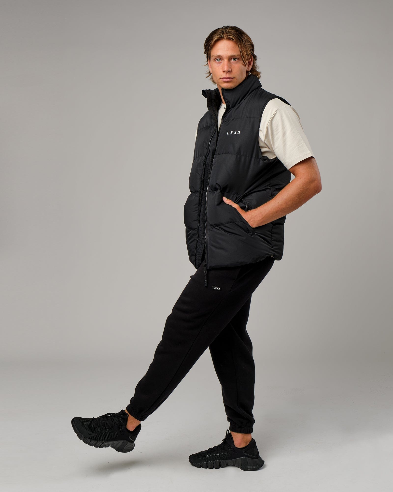Model wearing Essential Puffer Vest - Black