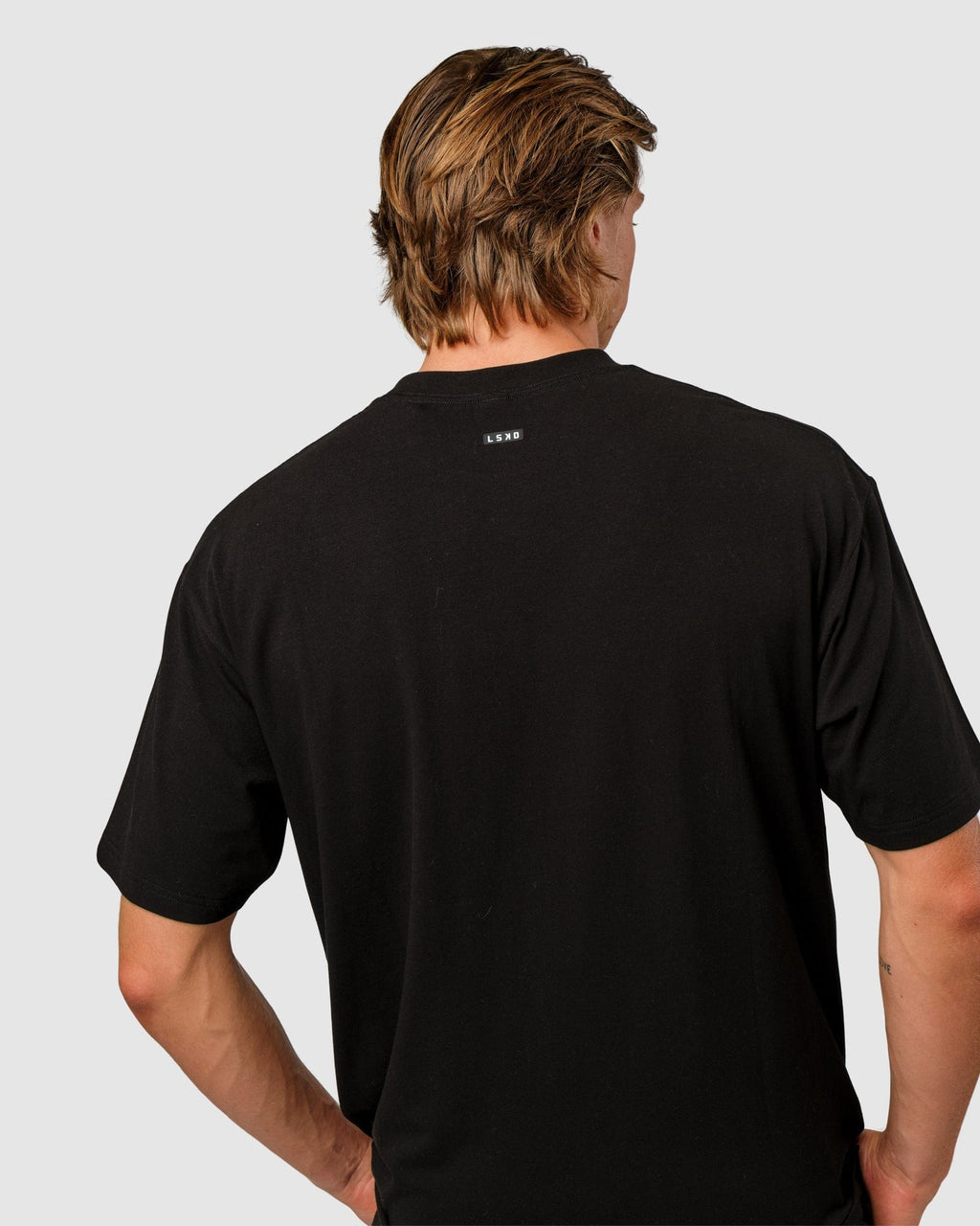 Model wearing Capsule Tee Oversize - Black