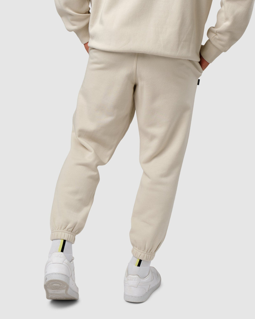 Model wearing Capsule Track Pant - Bone