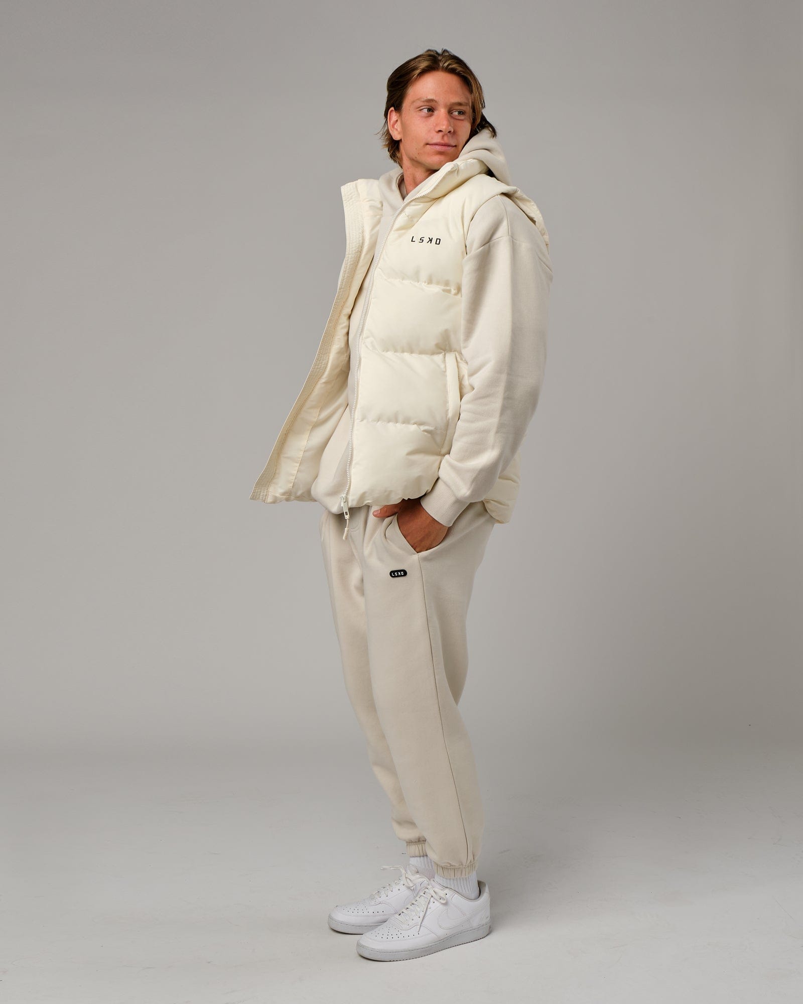 Model wearing Essential Puffer Vest - Cream