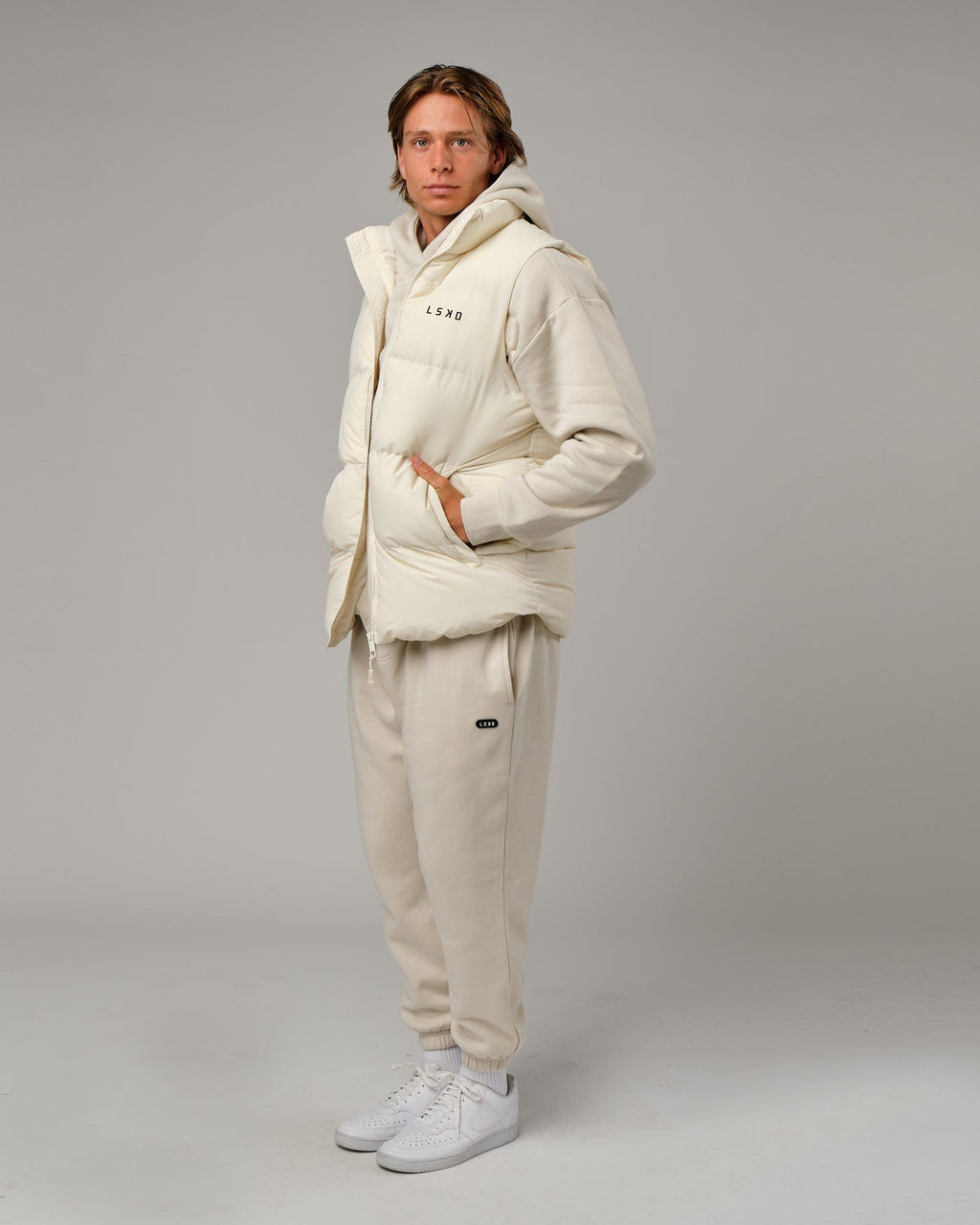 Model wearing Essential Puffer Vest - Cream