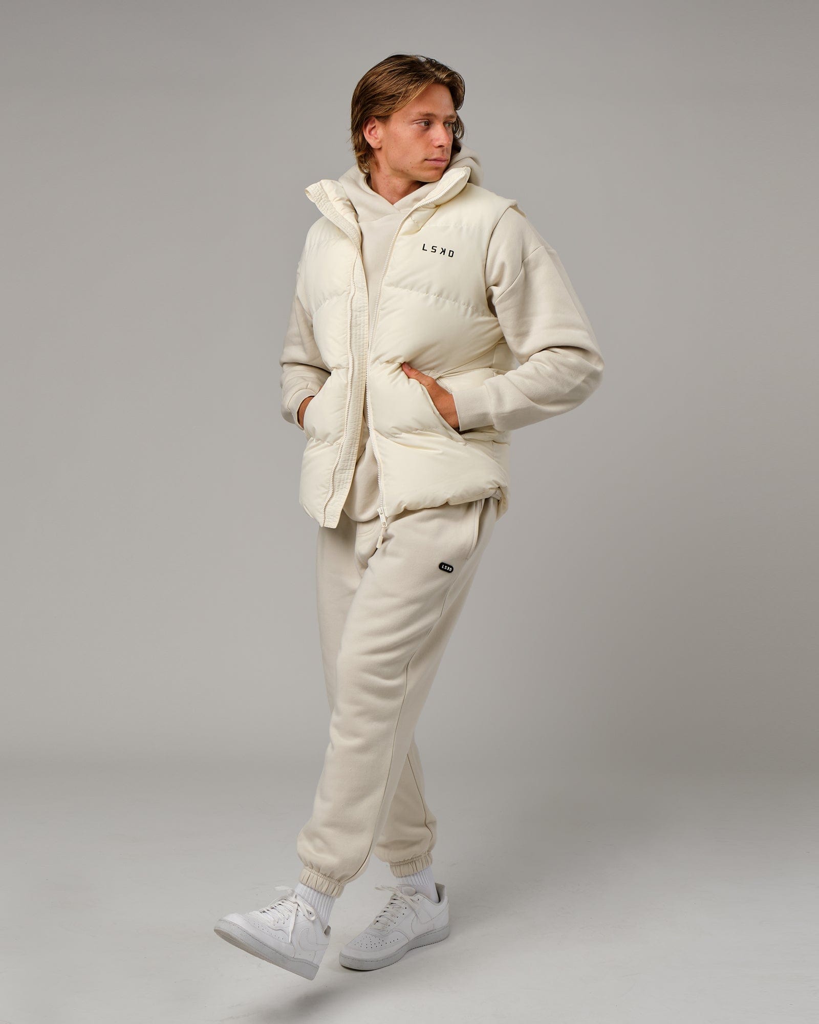 Model wearing Essential Puffer Vest - Cream