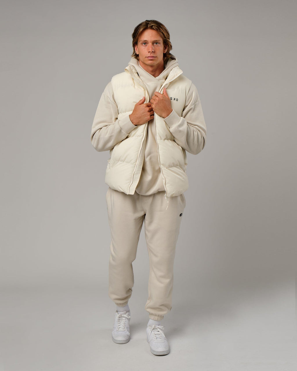 Model wearing Essential Puffer Vest - Cream