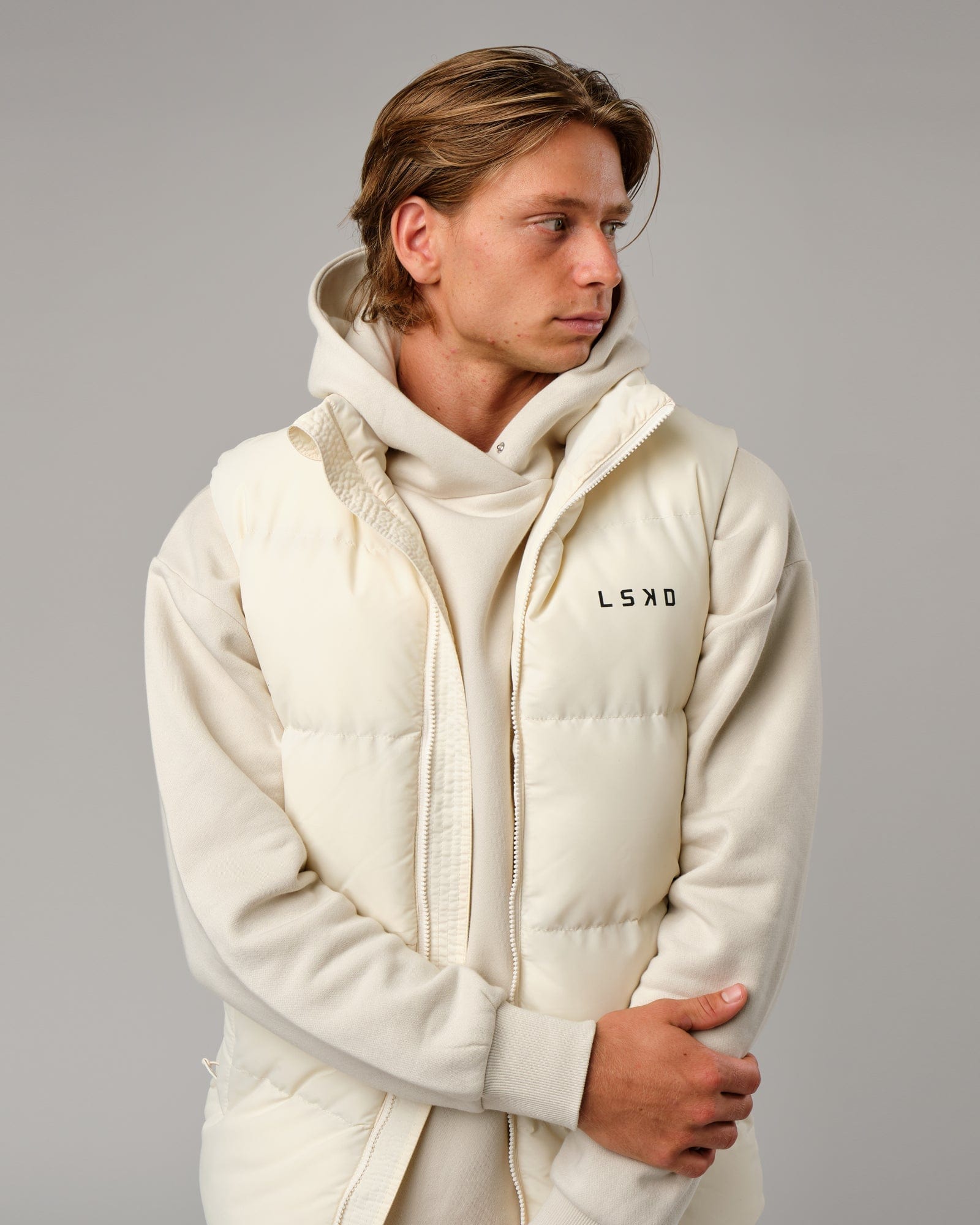 Model wearing Essential Puffer Vest - Cream