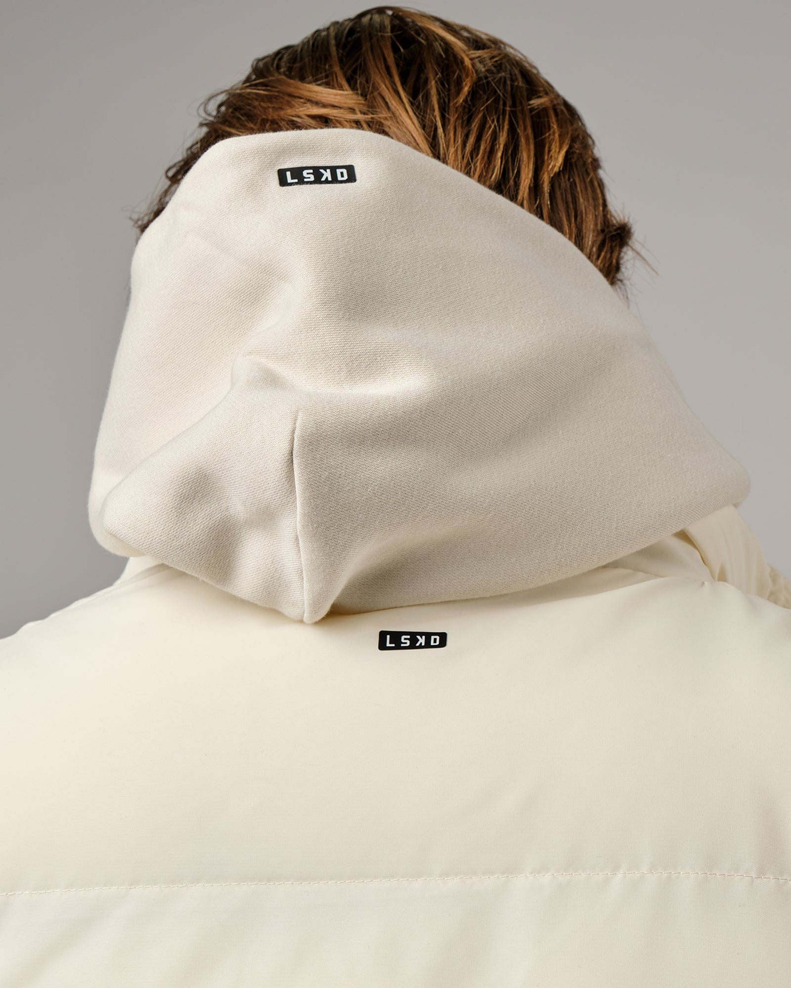 Model wearing Essential Puffer Vest - Cream