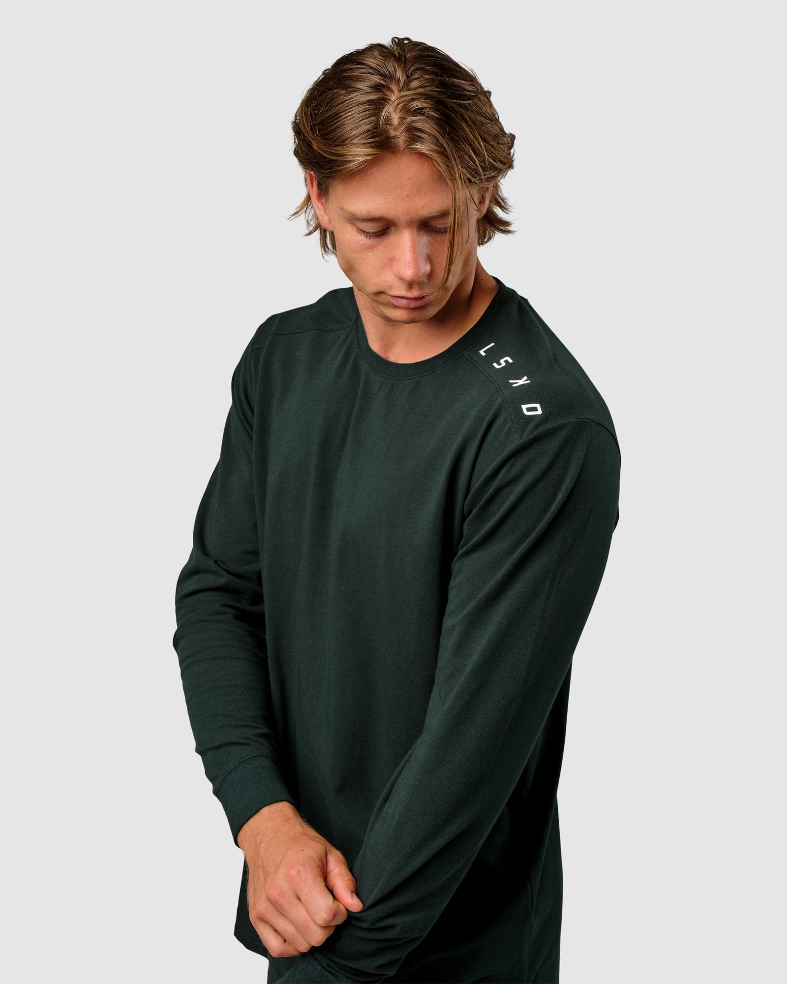 Model wearing Competitor LS Tee - Forest