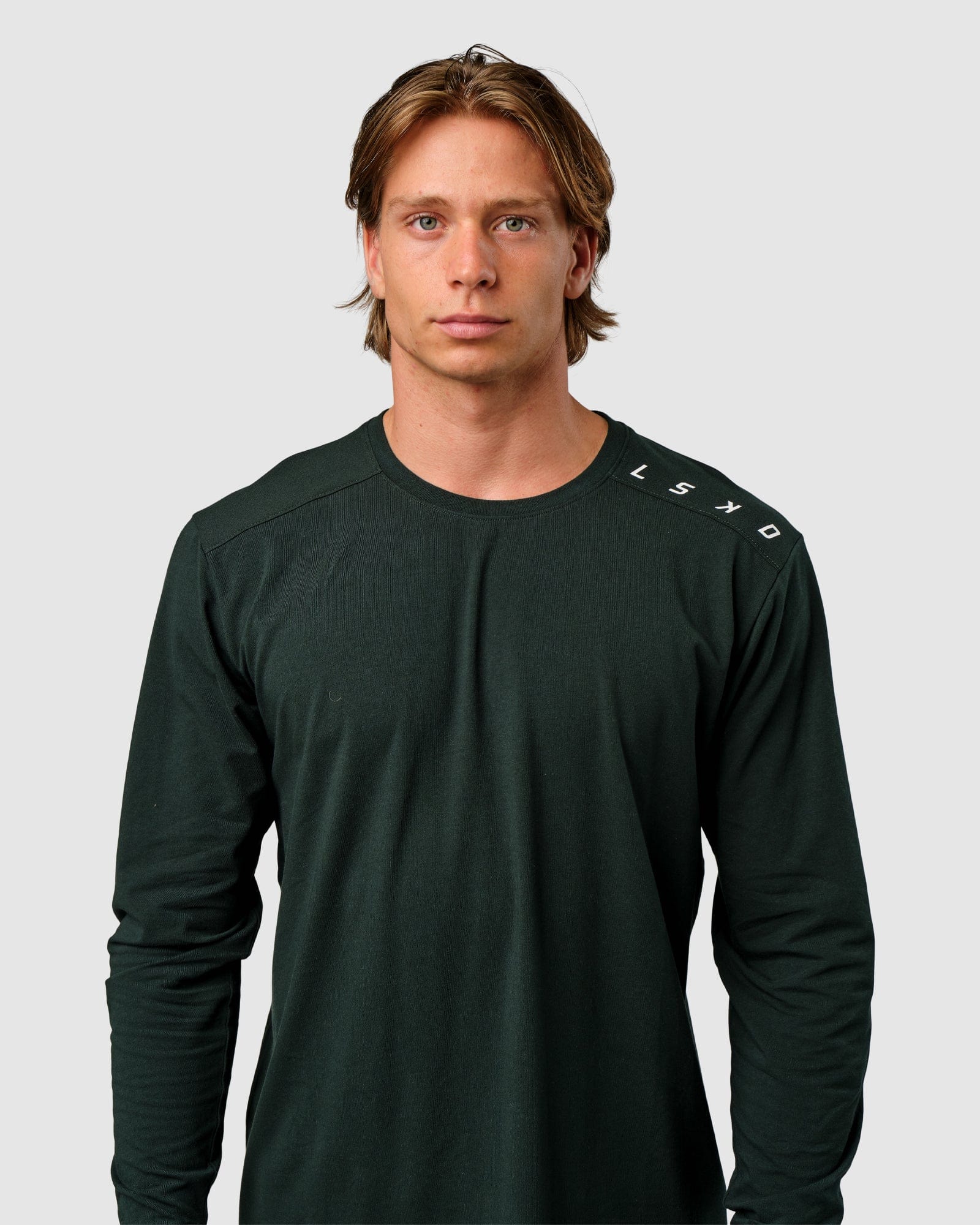 Model wearing Competitor LS Tee - Forest