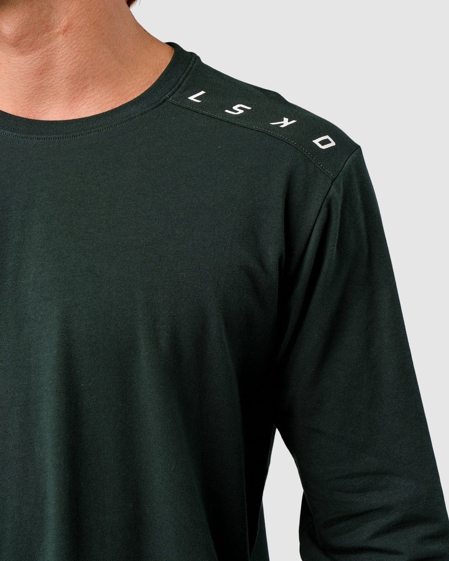 Model wearing Competitor LS Tee - Forest