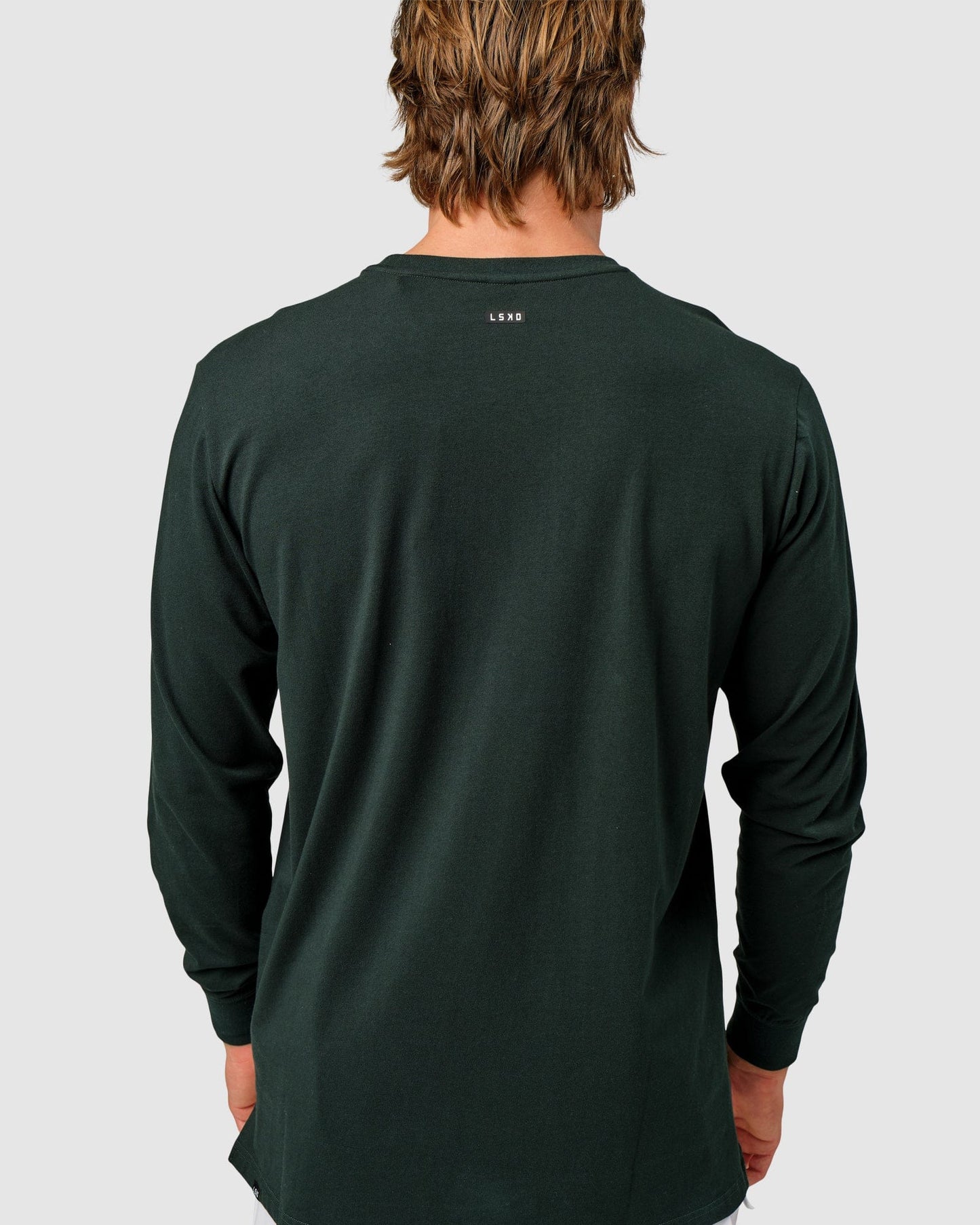 Model wearing Competitor LS Tee - Forest