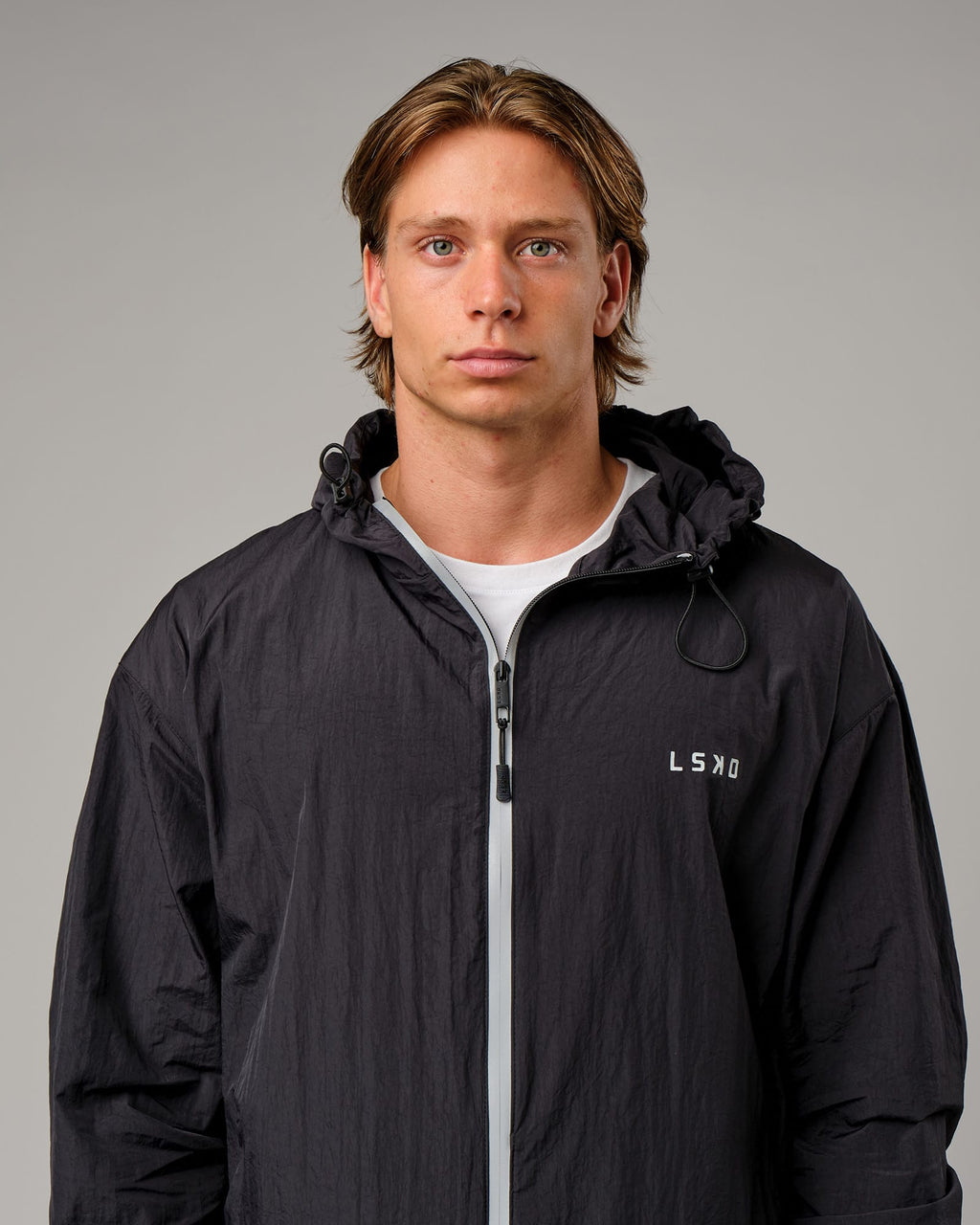 Model wearing Run Club Track Jacket - Black-Reflective