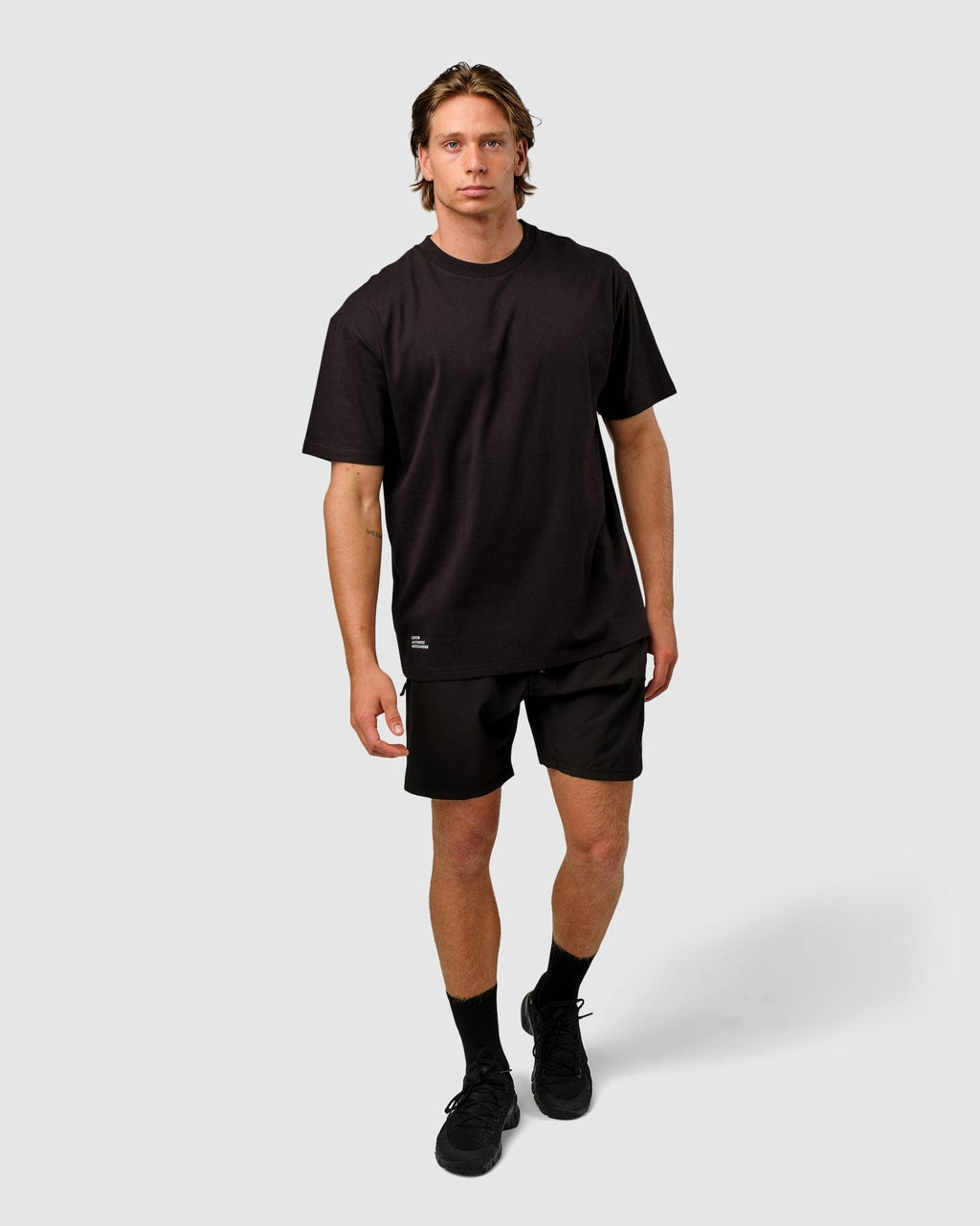 Model wearing OGTC Tee Oversize - Black