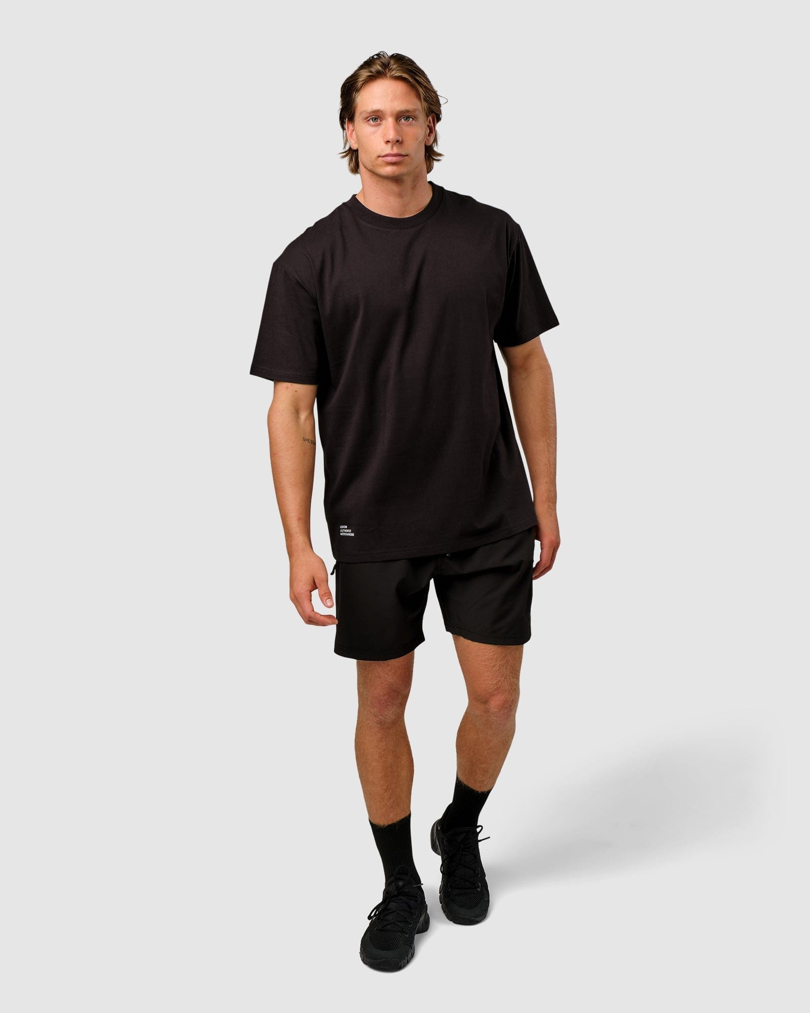 Model wearing OGTC Tee Oversize - Black