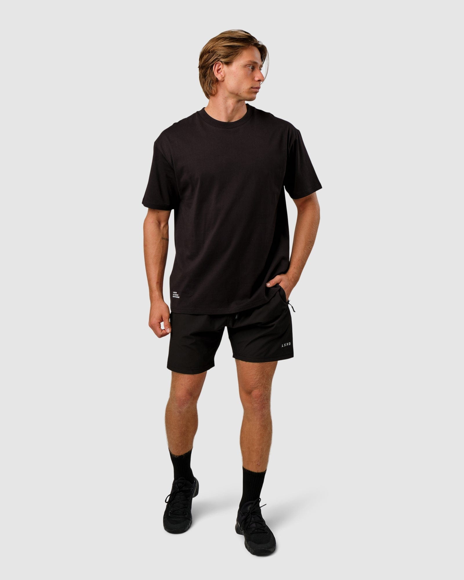 Model wearing OGTC Tee Oversize - Black