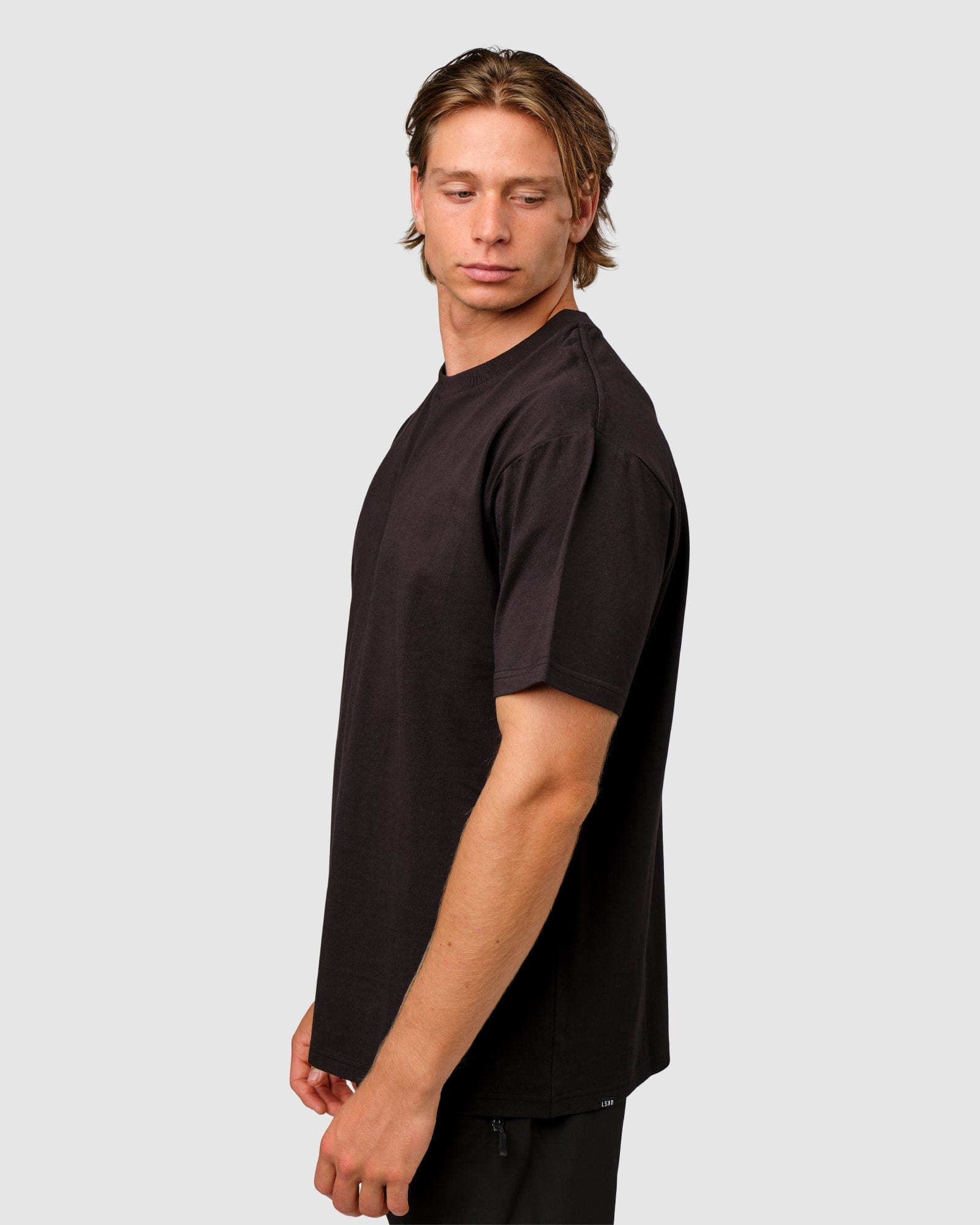 Model wearing OGTC Tee Oversize - Black