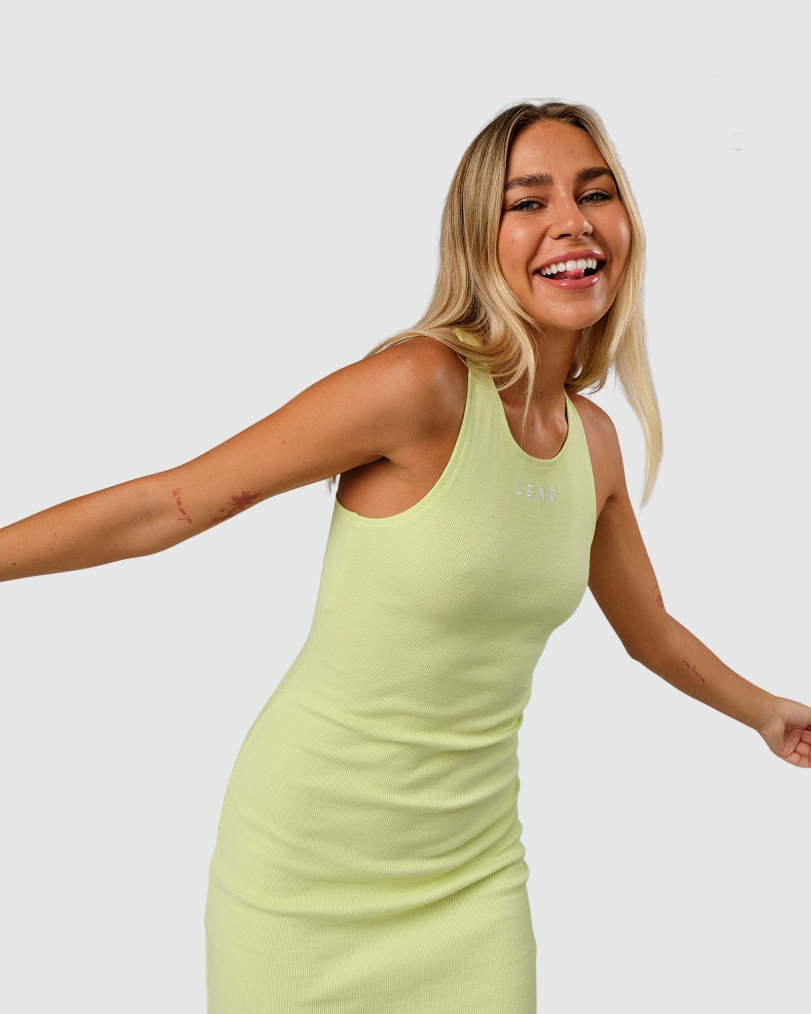 Model wearing Cece Ribbed Tank Dress - Pastel Lime