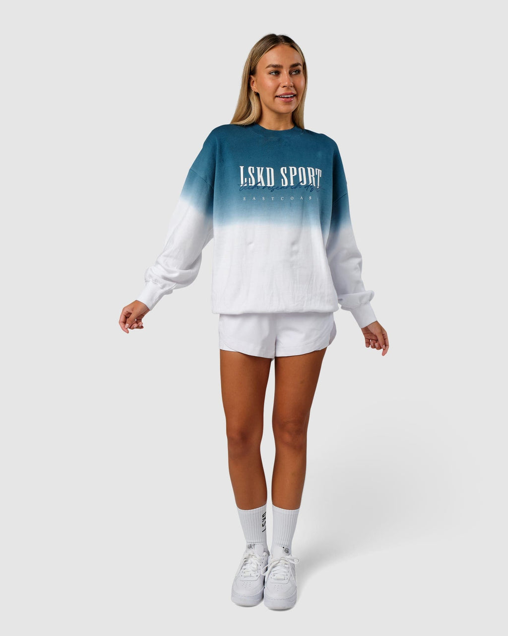 Model wearing Unisex Gradient Sweater - Atlantic-White